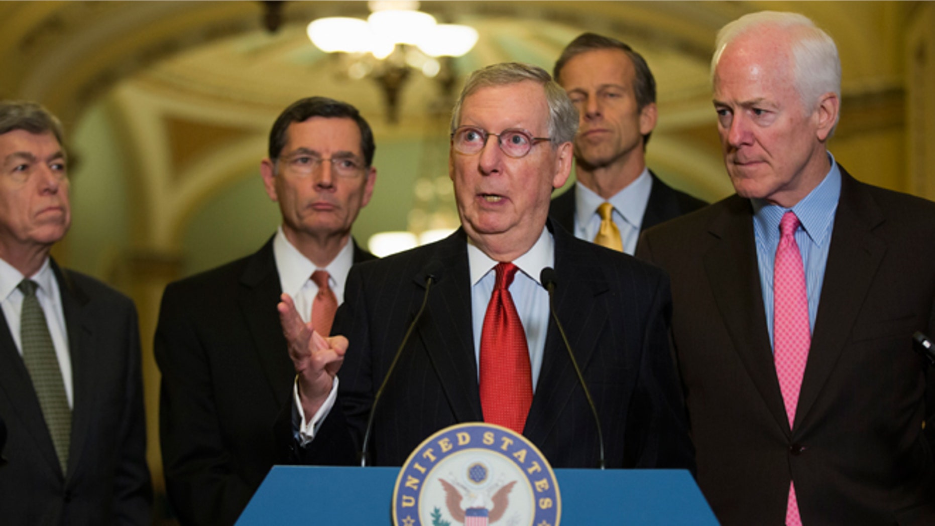 Dec. 2, 2014: Senate Minority Leader Mitch McConnell of Ky., center, gestures during a news conference on Capitol Hill in Washington. From left are, Sen. Roy Blunt, R-Mo., Sen. John Barrasso, R-Wyo., McConnell, Sen. John Thune, R-S.D., and Senate Minority Whip John Cornyn of Texas.