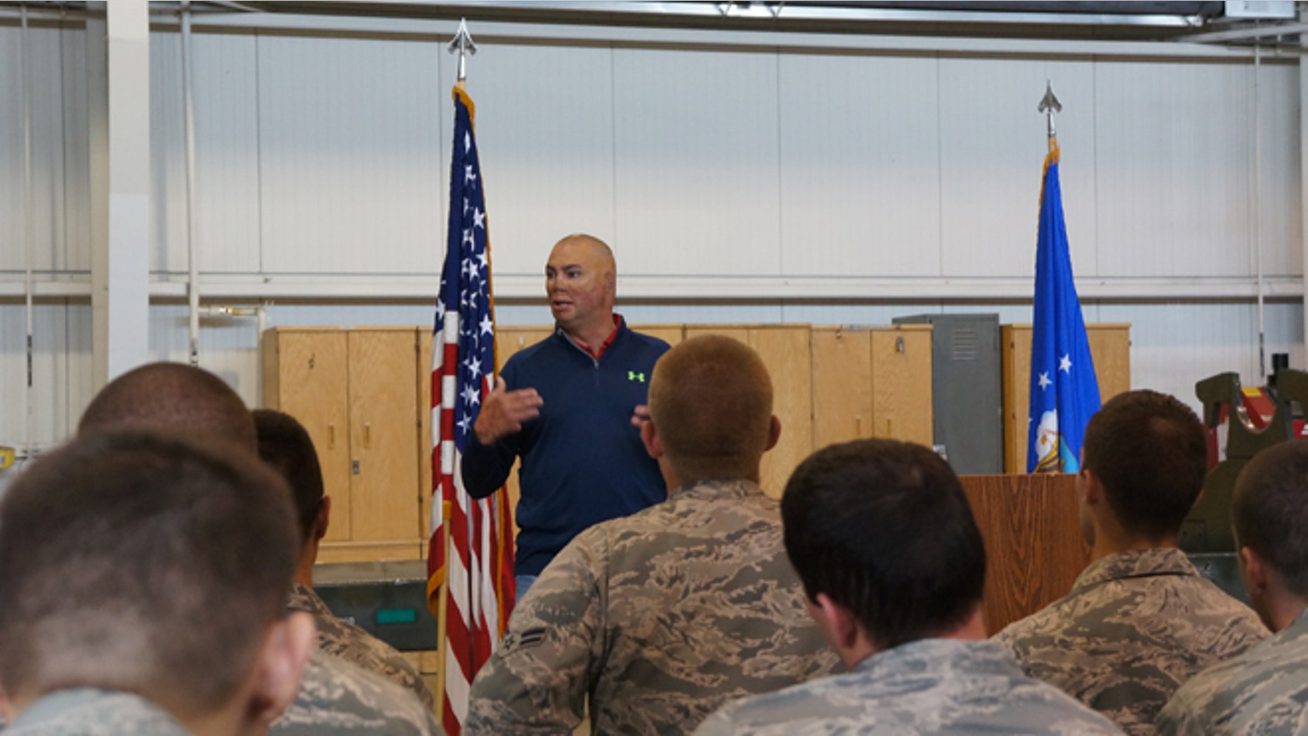 Author Shilo Harris speaks at Minot Air Force Base in North Dakota.