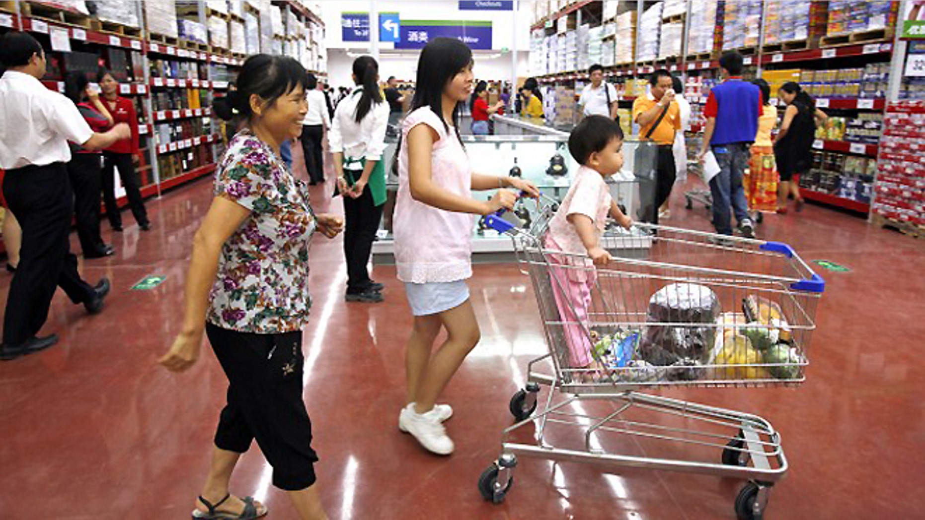 FILE -- Chinese customers shop at Walmart's first Sam's Club in China's southern city, Guangzhou.