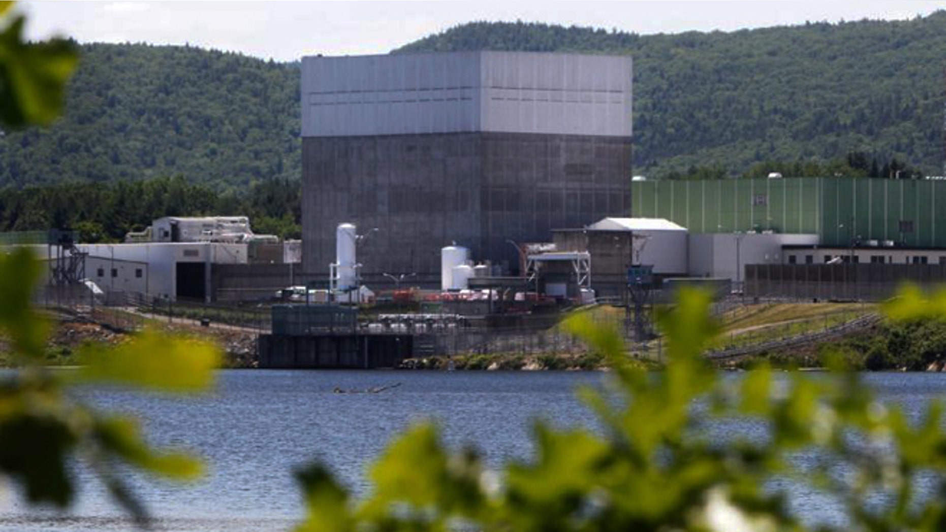 FILE -- June 19, 2013 photo, the Vermont Yankee Nuclear Power Station sits along the banks of the Connecticut River in Vernon, Vt. Entergy Corp., announced Tuesday, Aug. 27, 2013, it will shut down the nuclear power plant by end of 2014, ending a long legal battle with the state.