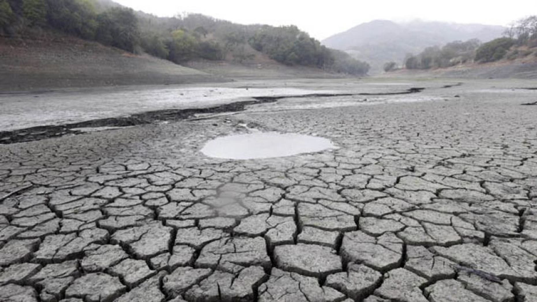 Feb. 7, 2014: This file photo shows the cracked-dry bed of the Almaden Reservoir in San Jose, Calif.