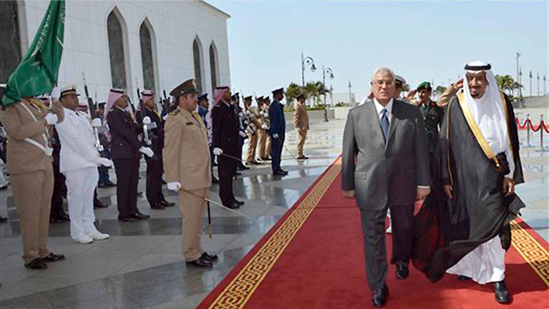 FILE -- Oct. 7, 2013: In this photo released by the Saudi Press Agency, Defense Minister and Saudi Crown Prince Salman bin Abdul-Aziz, right, welcomes Egyptian interim President Adly Mansour on his arrival to the airport in Jiddah, Saudi Arabia. Egypt's interim president has landed in Saudi Arabia for his first foreign trip since assuming power after the ouster of the country's Islamist president.