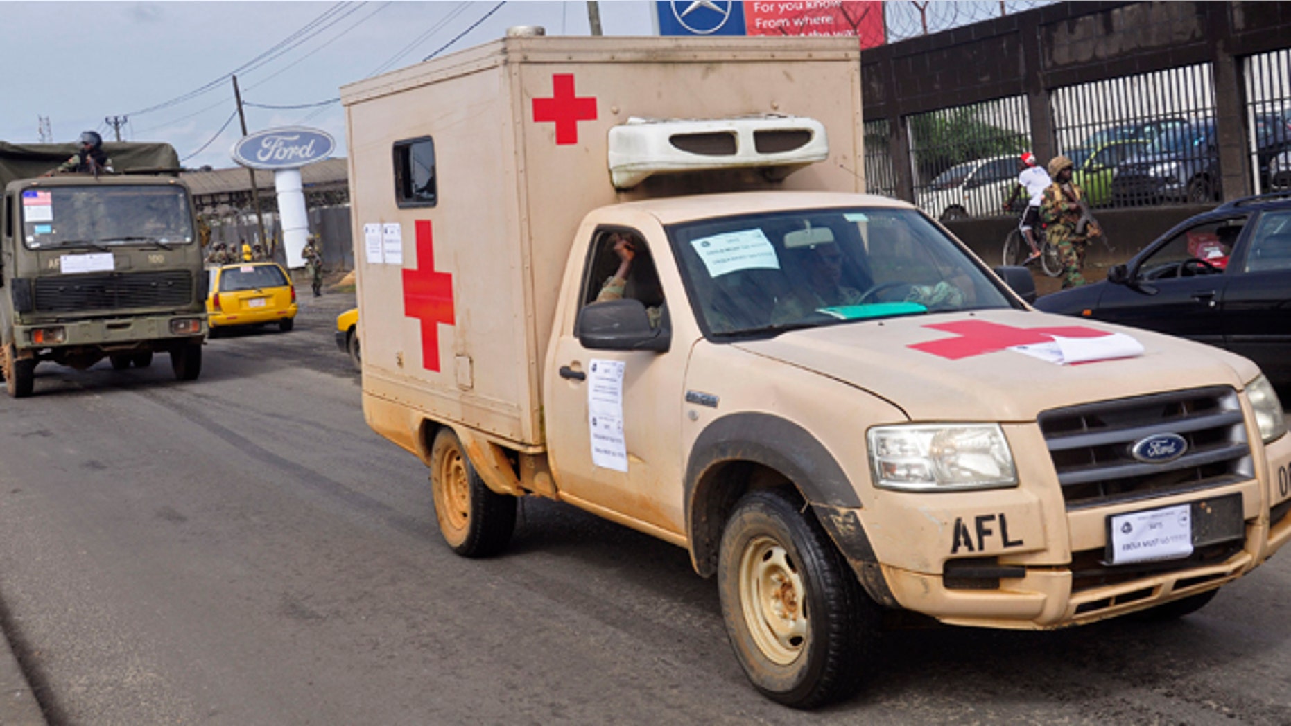 Aug. 1, 2014: Liberian soldiers in a medical truck drive past as they patrol streets to prevent panic, as fears of the deadly Ebola virus spread in the city of Monrovia, Liberia,.