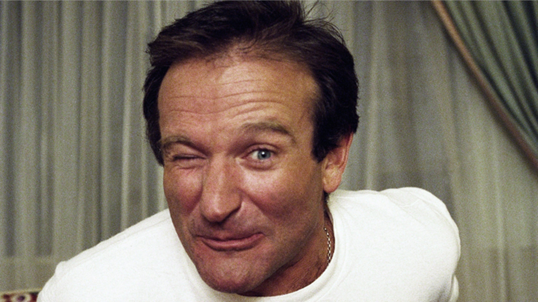 Comedian Robin Williams makes a face as he rises out of his chair during an interview, Nov. 15, 1993, New York. (AP Photo/Wyatt Counts)