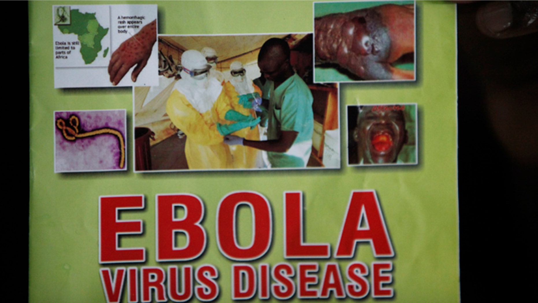 Nigeria health official display a leaflet explaining Ebola Virus Disease at the arrival hall of Murtala Muhammed International Airport in Lagos, Nigeria, Monday, Aug. 4, 2014. Nigerian authorities on Monday confirmed a second case of Ebola in Africa's most populous country, an alarming setback as officials across the region battle to stop the spread of a disease that has killed more than 700 people. (AP Photo/Sunday Alamba)