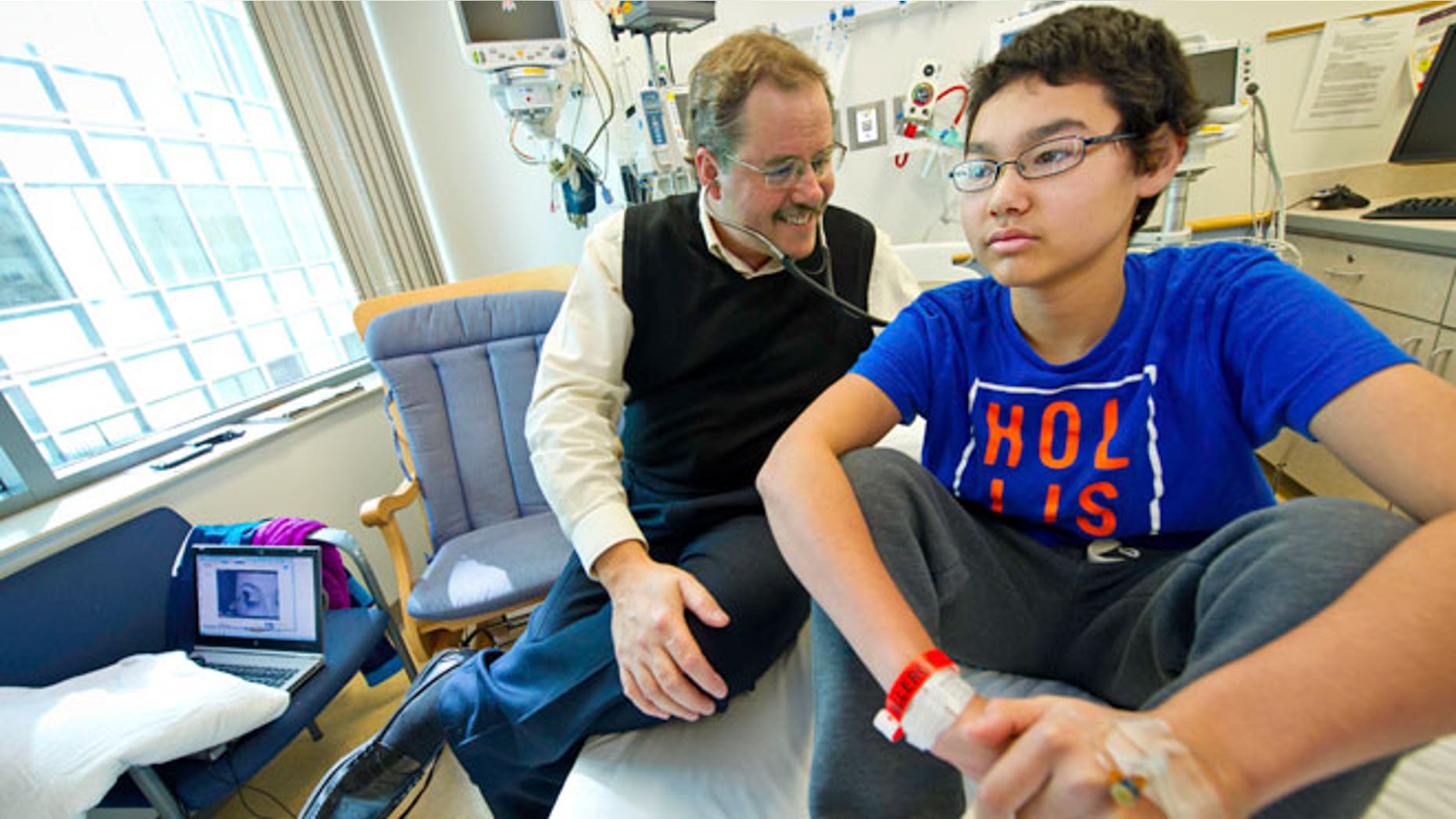 Dr. Stephan Grupp, of the Children's Hospital of Philadelphia (CHOP), with patient Nick Wilkins.