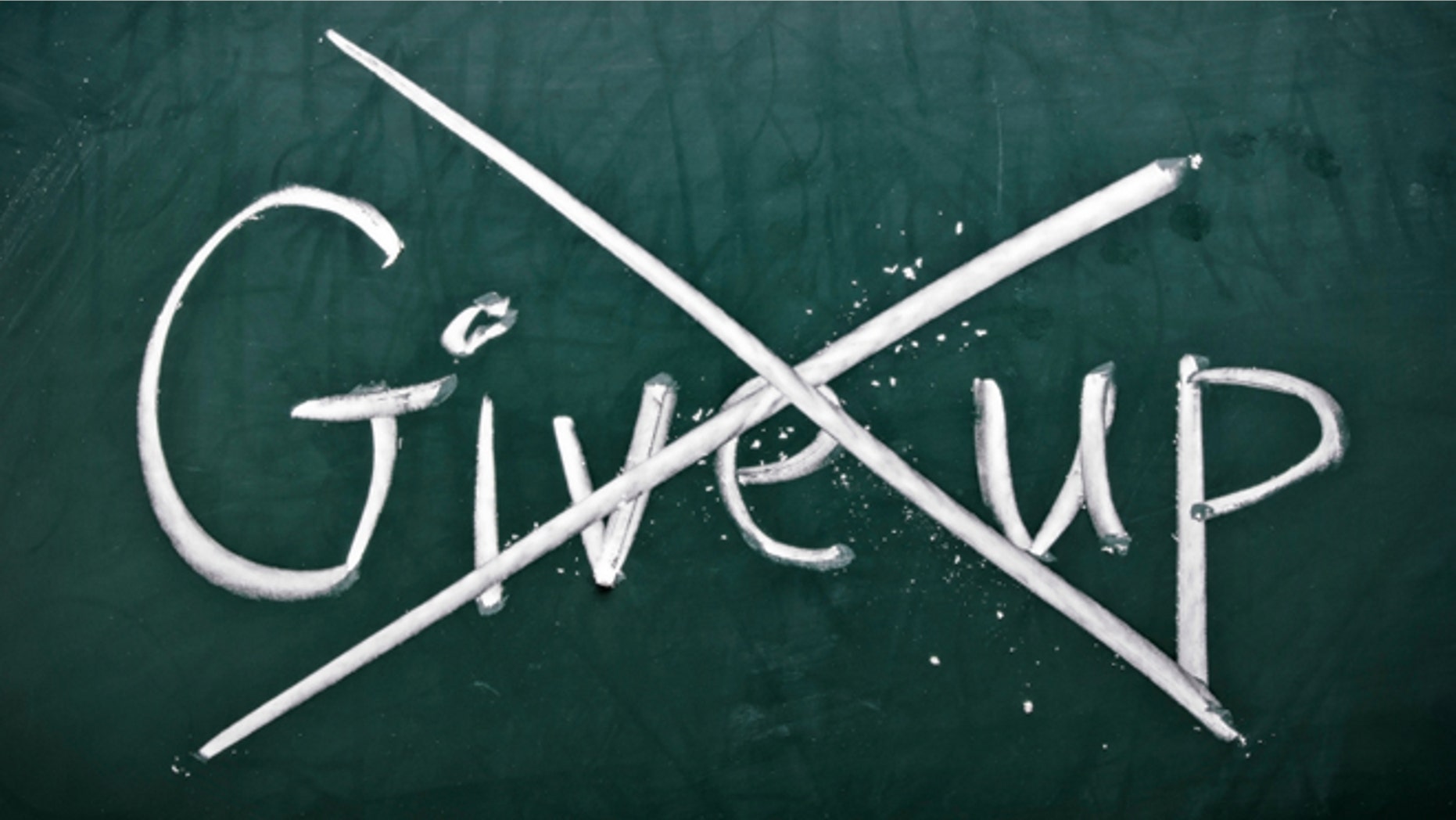Do not give up, words on blackboard