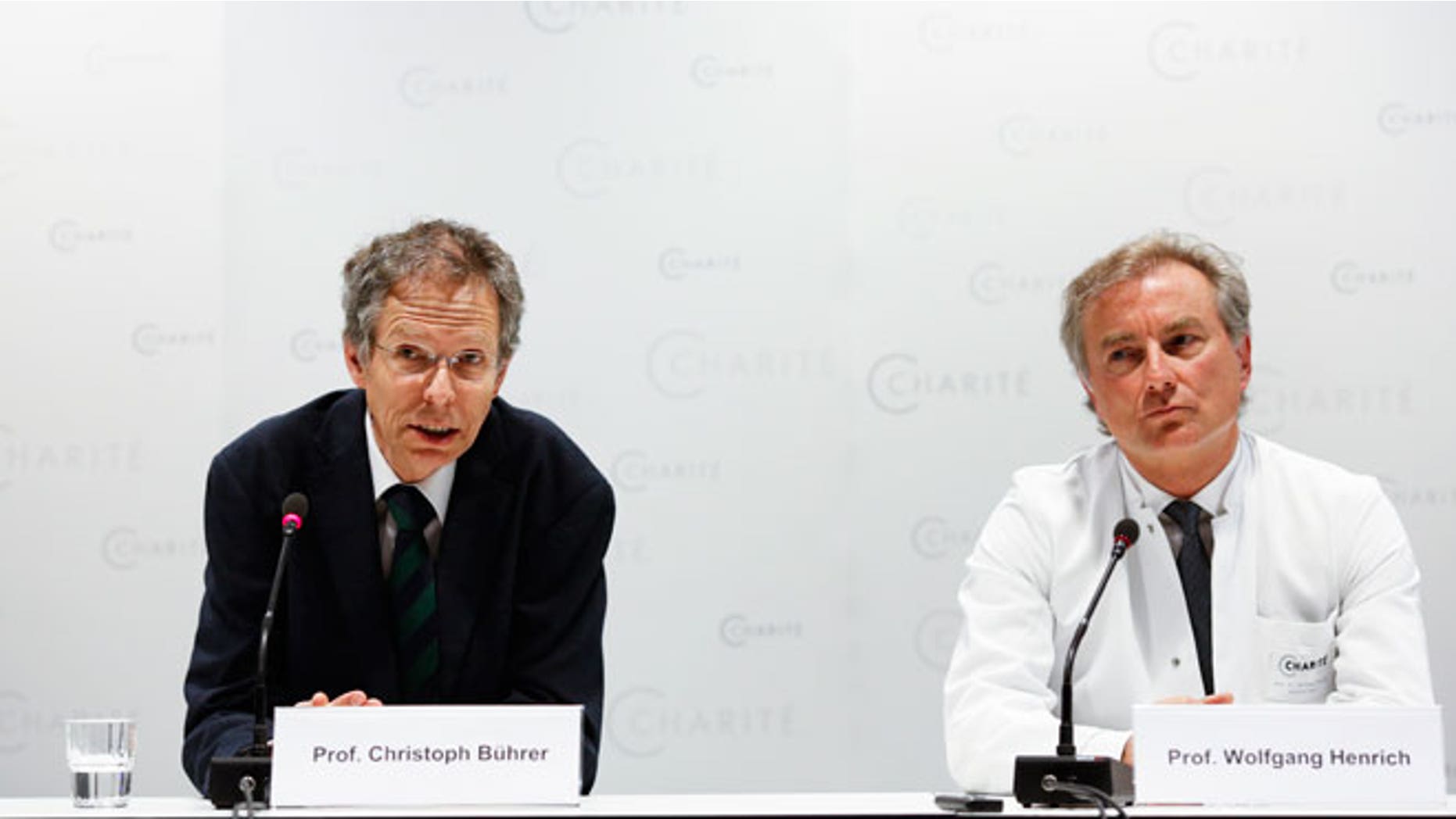 Christoph Buehrer, left, director of neonatology at Charite Hospital and Wolfgang Henrich, director of gynecology at Charite Hospital, brief the media about the situation of a 65-year old mother Annegret Raunigk and her quadruplets, in Berlin, Germany, Wednesday, May 27, 2015. Doctors say the quadruplets born prematurely to a 65-year-old Berlin woman are still in intensive care, but have been gaining a little weight and are being given their mother's milk through feeding tubes.