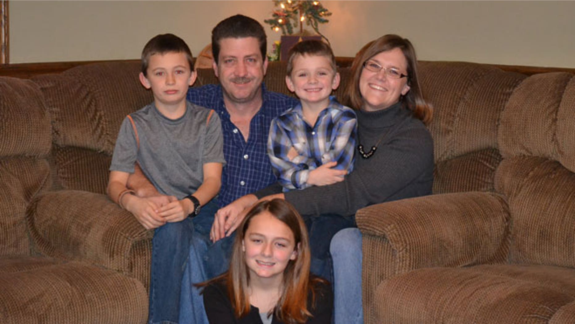 From back to center: Mandy and Jeff Holt, Ethan, 11 (left), Elliot, 7 (right), and Emily, 15 (center).