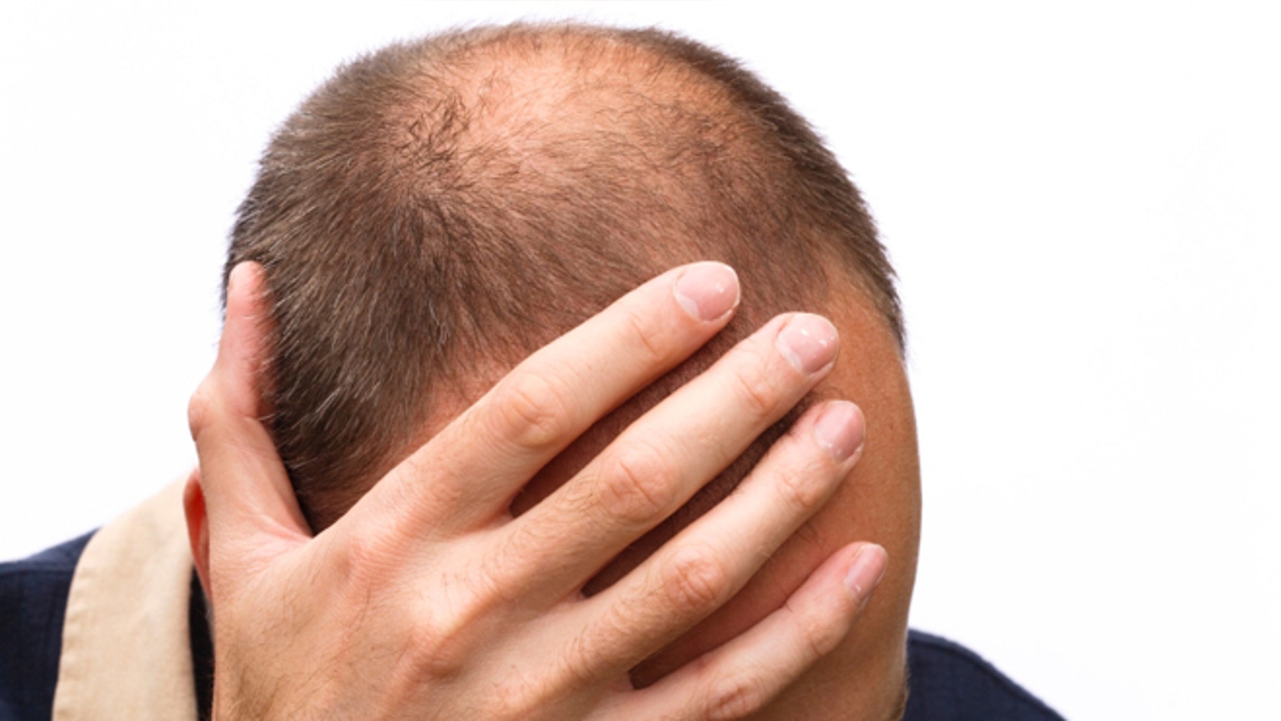 Man expressing stress, worry or depression; isolated against a white background