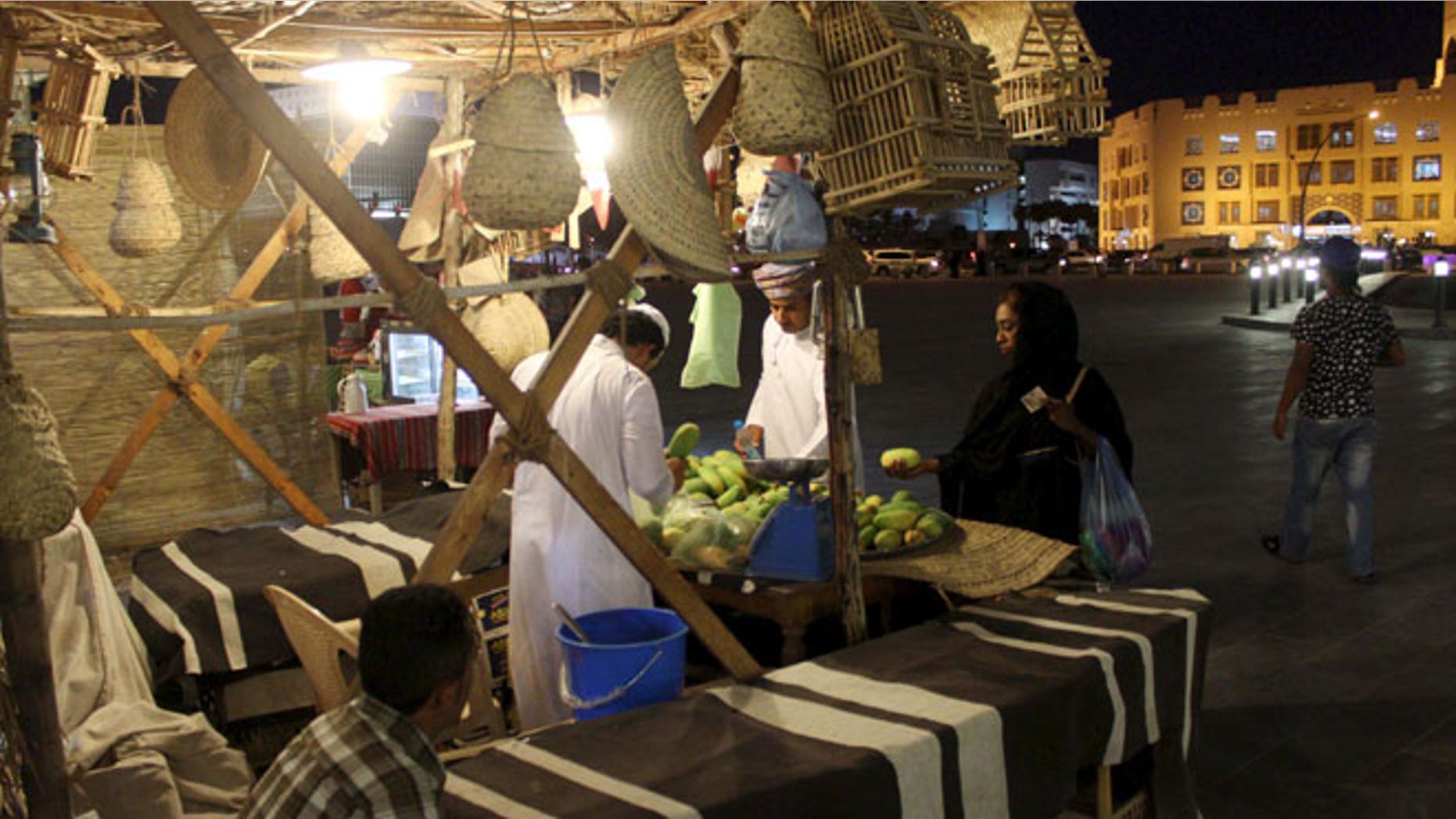 People shop at Souq Waqif market ahead of the holy month of Ramadan in Doha June 17, 2015.