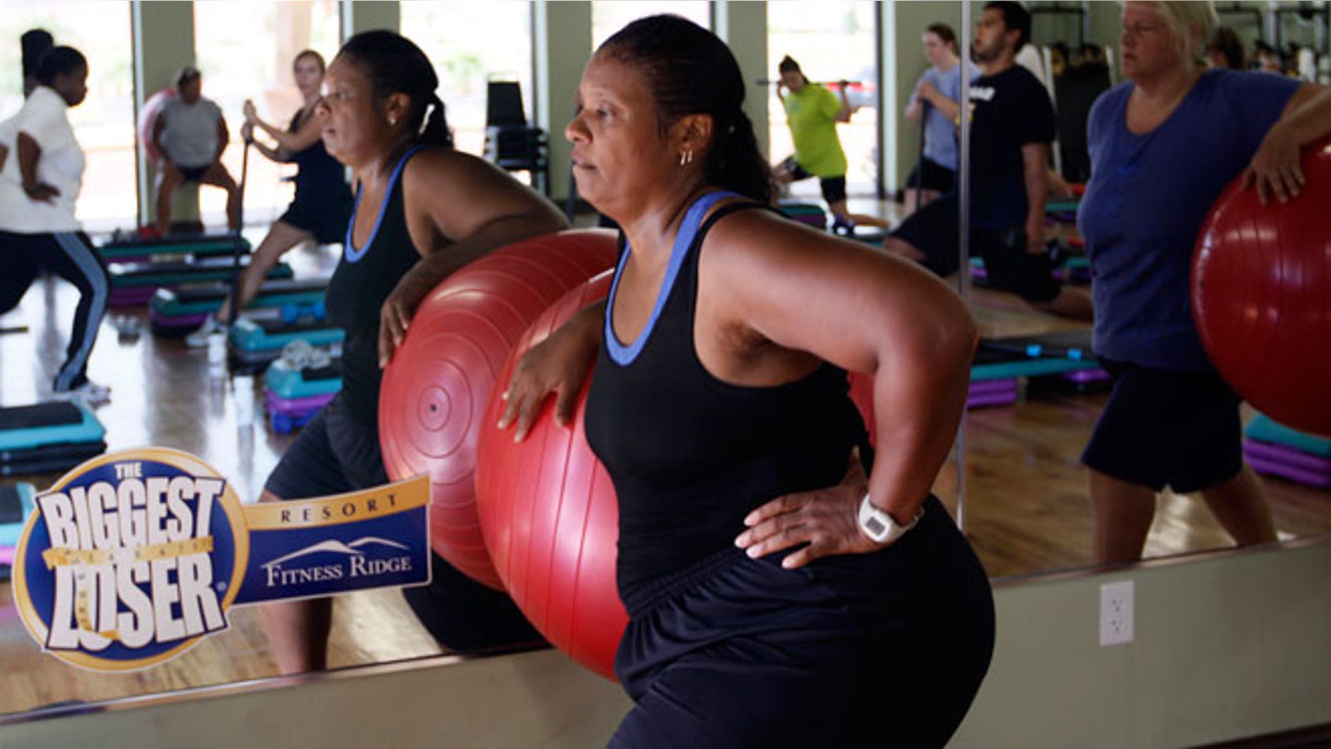 Guest Stacey Scott works out with a stability ball in a "total toning" class at the Biggest Loser Resort in Ivins, Utah September 7, 2010. Guests at the resort affiliated with the popular reality television show eat about 1,200 calories a day but burn over 2,000 exercising 6 - 7 hours daily.