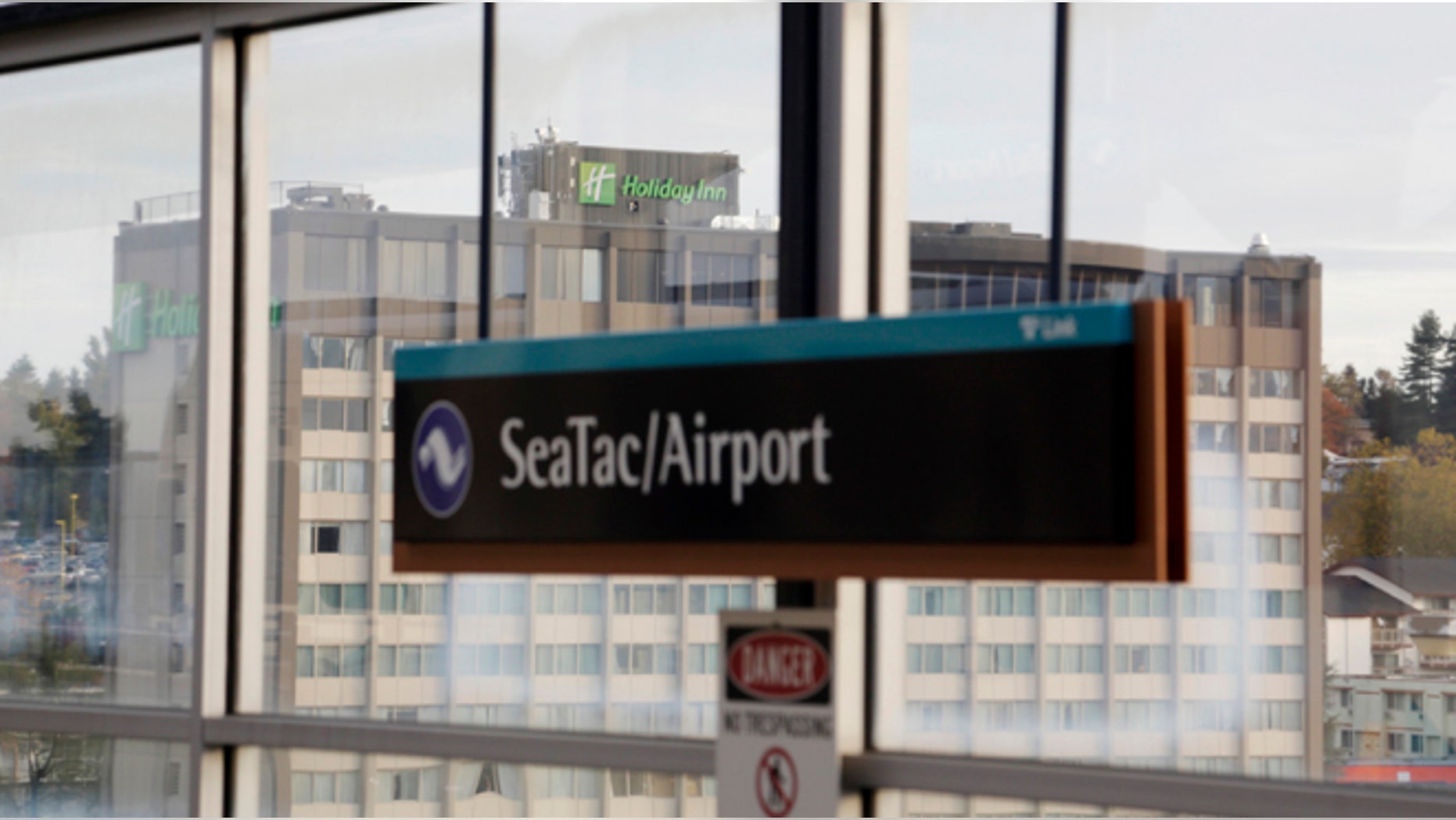 A Holiday Inn hotel is seen across from the light rail station at Seattle-Tacoma International Airport in SeaTac, Washington October 30, 2013. Voters in the working-class Seattle suburb of SeaTac, which encompasses the region's main airport, will decide on November 5, 2013 whether to enact one of the country's highest minimum wages in a ballot measure supporters hope will serve as a model for similar efforts elsewhere. Amid debate about income inequality in America, the ballot initiative in SeaTac, Washington, would mandate that 6,300 workers at Sea-Tac International Airport and nearby hotels, car rental agencies and parking lots receive a minimum hourly wage of $15, more than double the current federal minimum wage of $7.25. Picture taken October 30, 2013. REUTERS/Jason Redmond (UNITED STATES - Tags: POLITICS BUSINESS TRANSPORT EMPLOYMENT) - RTX150RP