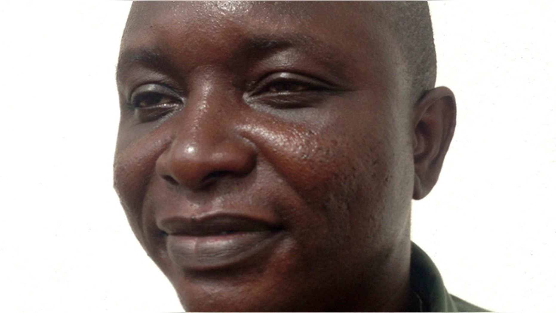 Sheik Umar Khan, head doctor fighting the deadly tropical virus Ebola in Sierra Leone, poses for a picture in Freetown, June 25, 2014. Khan, a Sierra Leonean virologist credited with treating more than 100 Ebola victims, has been transferred to a treatment ward run by medical charity Medecins Sans Frontieres after being infected by the Ebola virus, according to the statement released late on July 22, 2014 by the president's office. REUTERS/Umaru Fofana (SIERRA LEONE - Tags: HEALTH HEADSHOT) - RTR3ZTOE