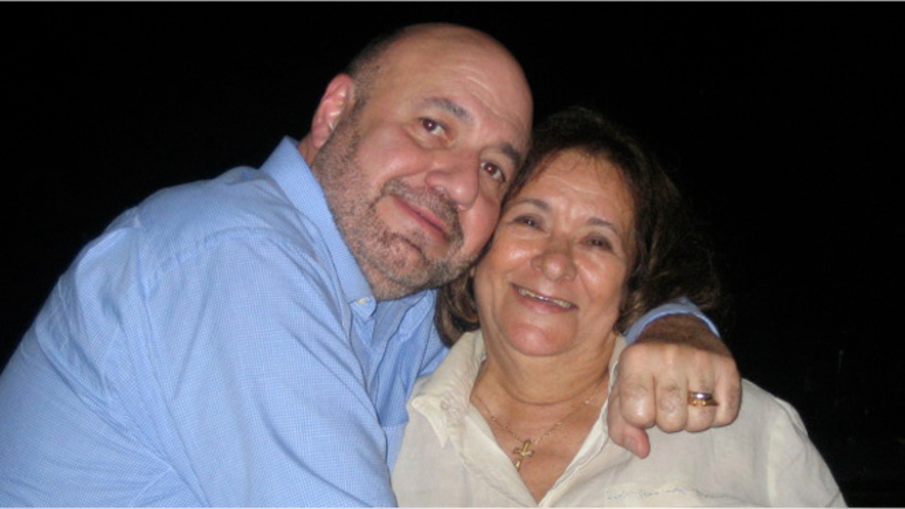 Dr. Manny poses with his mother, Elisa Alvarez.