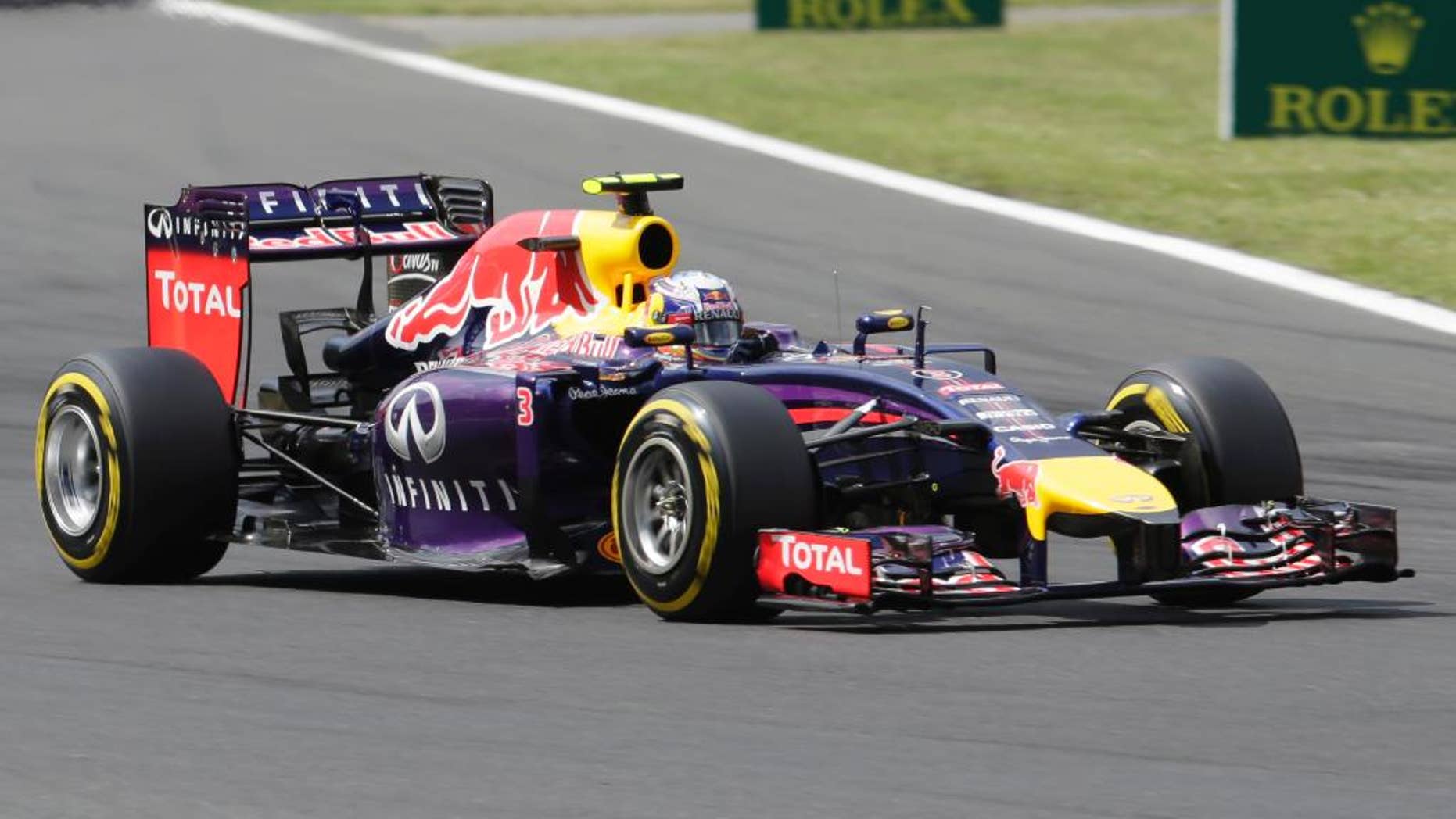 Red Bull driver Daniel Ricciardo of Australia steers his car during the qualifying of the Hungarian Formula One Grand Prix in Budapest, Hungary, Saturday, July 26, 2014. The Hungarian Grand Prix will be held on Sunday, July 27, 2014. (AP Photo/Petr David Josek)