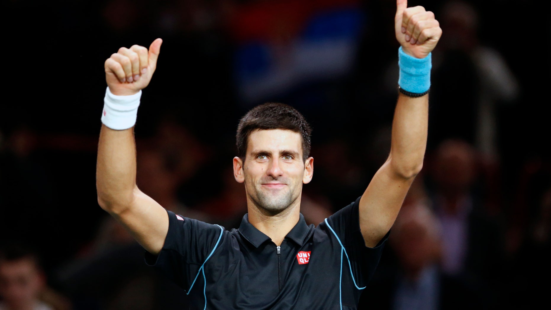 Novak Djokovic of Serbia celebrates after winning against John Isner of the USA during their round of eight match, at the Paris Masters tennis at Bercy Arena in Paris, France, Thursday, Oct. 31, 2013. (AP Photo/Francois Mori)