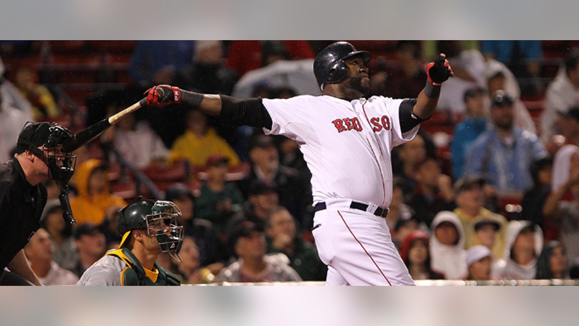 David Ortiz #34 of the Boston Red Sox hits a home run against the Oakland Athletics at Fenway Park on Aug. 27, 2011 in Boston, Massachusetts. (Photo by Jim Rogash/Getty Images)