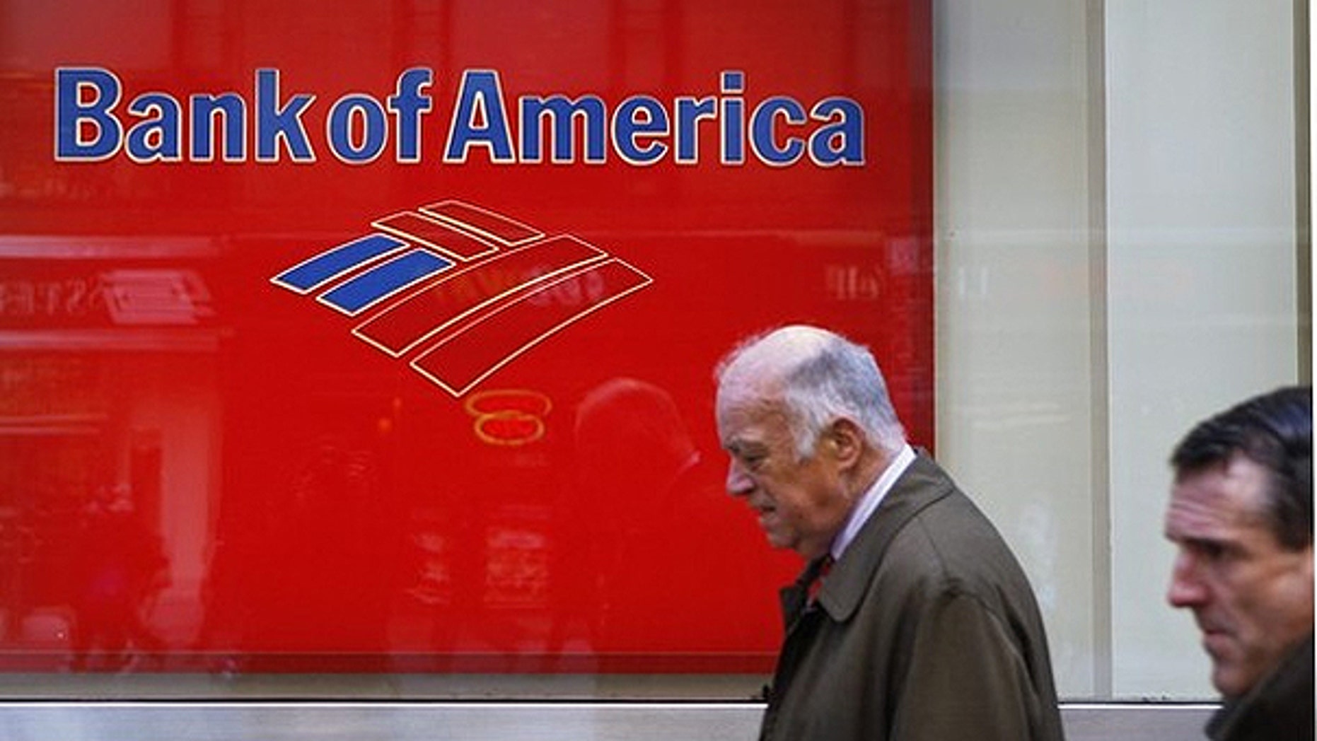 March 8: Pedestrians walk past a Bank of America sign on the street in New York.