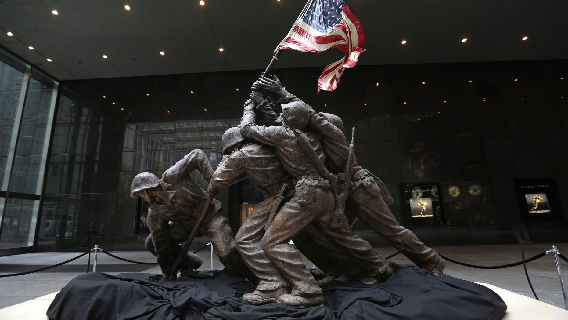The original 12 1/2-foot (4 meter) cast stone version of Felix de Weldon's iconic statue depicting soldiers raising the U.S. flag at Iwo Jima is on display, Friday, Feb. 22, 2013. The smaller original statue, which was removed in 1947 and hidden under a tarp at the artist's studio for four decades, is expected to fetch up to $1.8 million when it goes on sale at Bonham's auction house in New York on Feb. 22, 2013. (AP Photo/Mary Altaffer)
