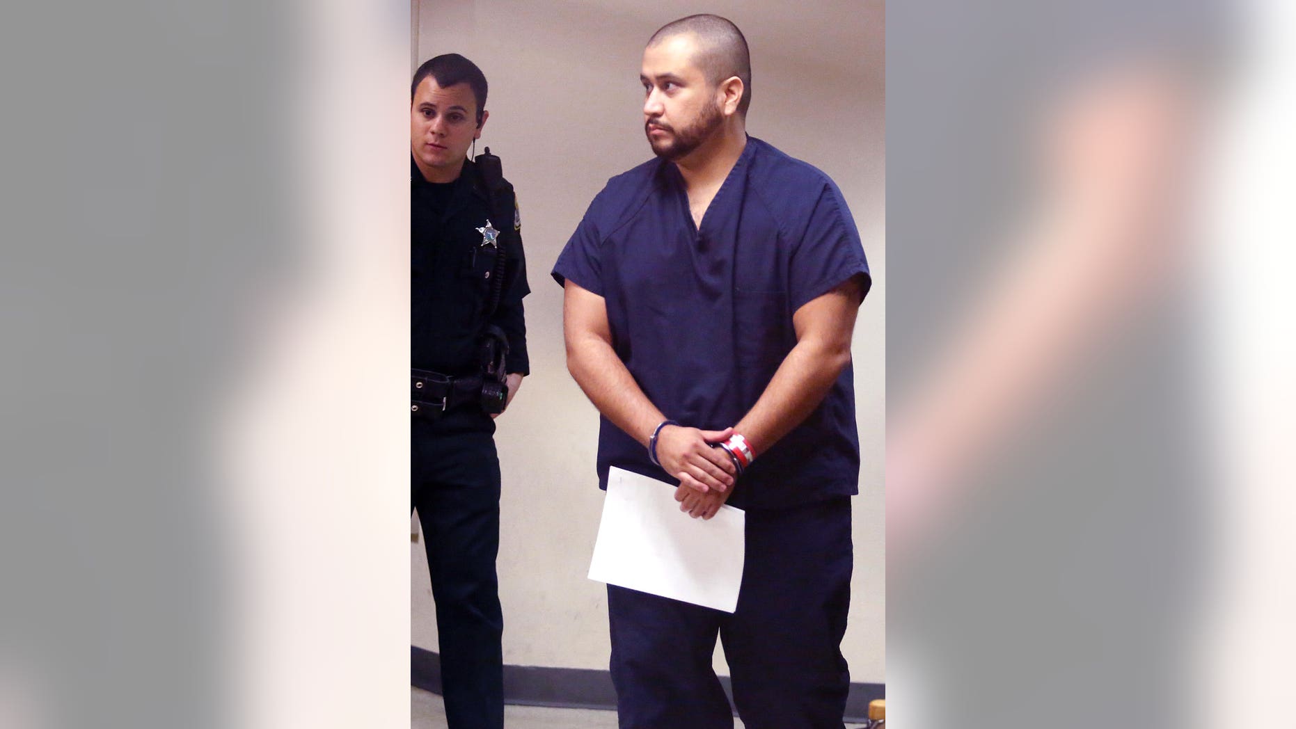 Zimmerman in handcuffs at the Seminole County Courthouse in Sanford, Fla. on Sat. Jan. 10, 2015.