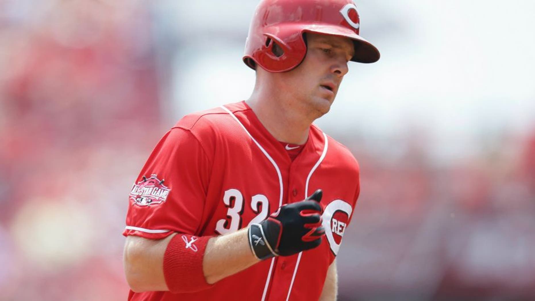 Cincinnati Reds right fielder Jay Bruce rounds the bases after hitting a solo home run off San Diego Padres starting pitcher Odrisamer Despaigne in the first inning of a baseball game, Sunday, June 7, 2015, in Cincinnati. (AP Photo/John Minchillo)