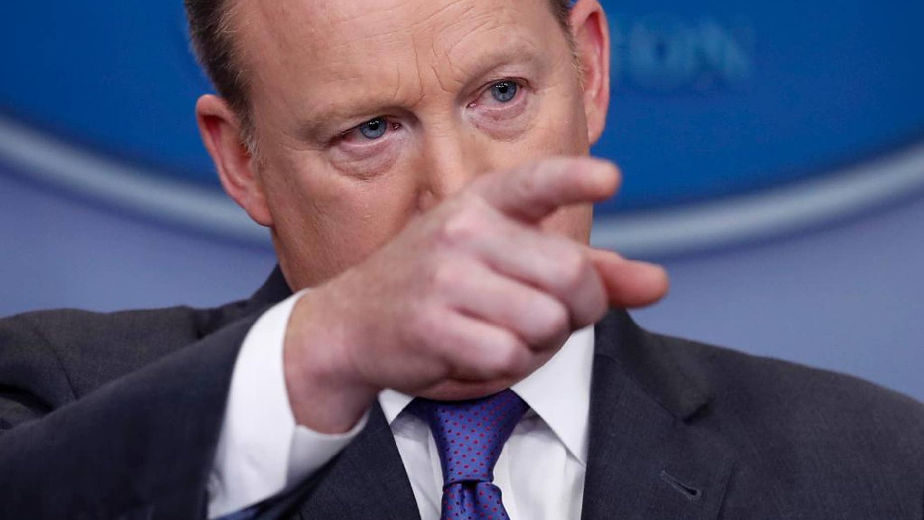 White House press secretary Sean Spicer points to a reporter to take a question during the daily news briefing at the White House in Washington, Monday, Jan. 30, 2017. Spicer discussed the weekend's immigration turmoil and other topics. (AP Photo/Carolyn Kaster)
