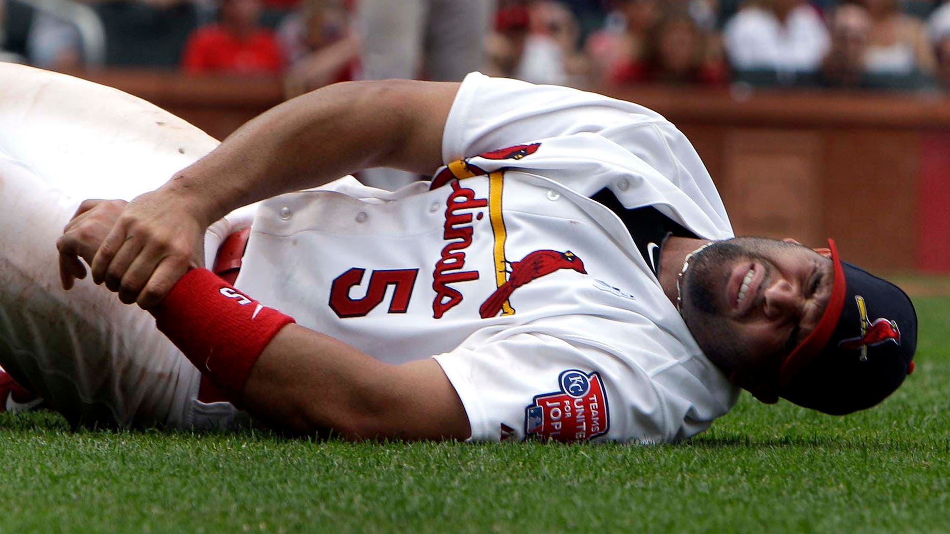 June 19: St. Louis Cardinals first baseman Albert Pujols injured his left wrist in the sixth inning in a game against the Kansas City Royals. (AP Photo/Jeff Roberson)