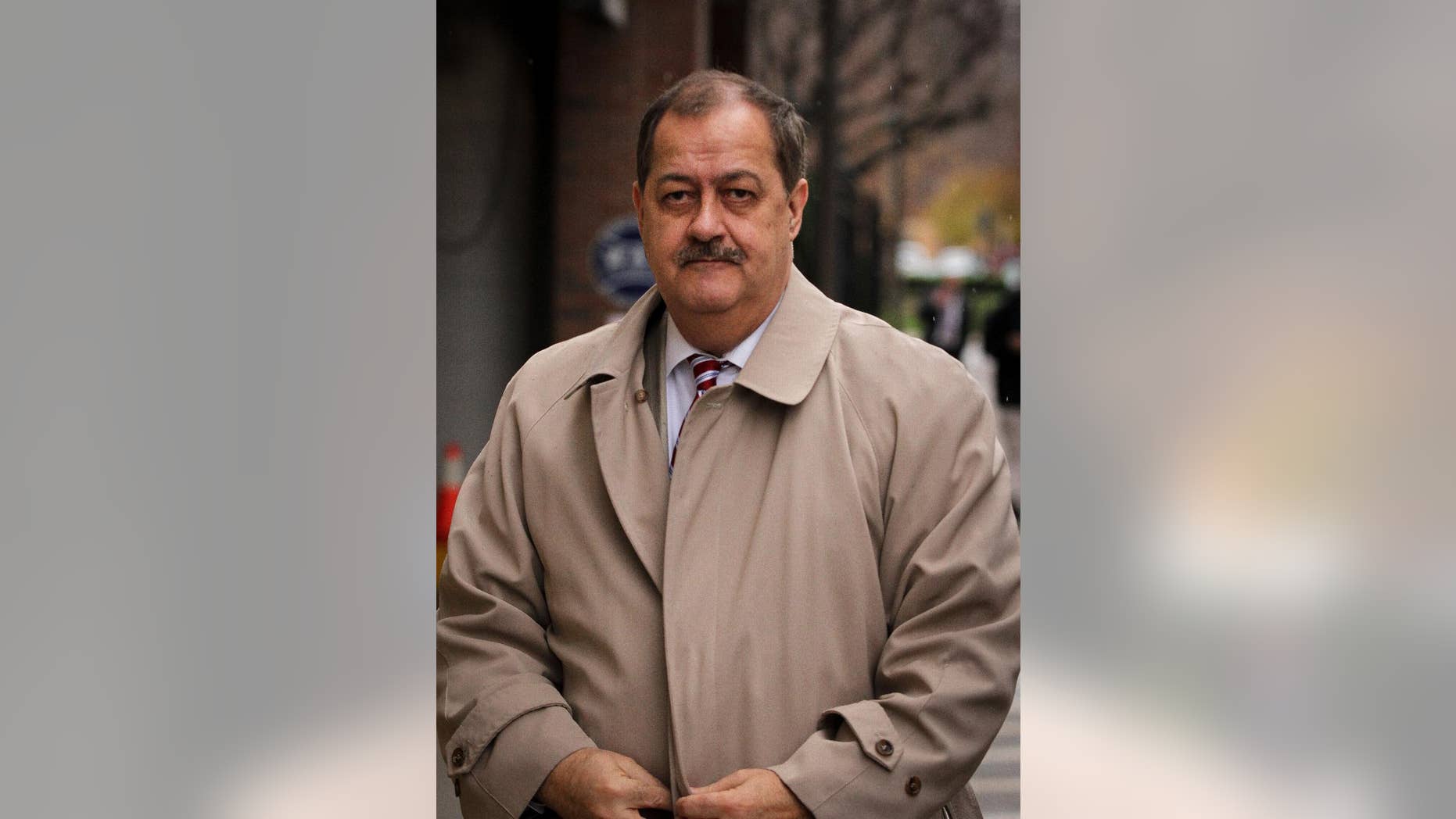 FILE -In this Tuesday, Dec. 1, 2015, file photo, Former Massey Energy CEO Don Blankenship makes his way out of the Robert C. Byrd U.S. Courthouse during a break in deliberations, Charleston, W.Va. Jurors have resumed deliberations in ex-Massey Energy CEO Don Blankenship's trial. Thursday, Dec. 3, 2015. Jurors have said twice they couldn't agree on a verdict. They have deliberated for all or part of nine days. Blankenship is charged with conspiring to break safety laws and defrauding mine regulators at West Virginia's Upper Big Branch Mine and lying to financial regulators and investors about safety. The coal mine exploded in 2010, killing 29 men. (AP Photo/Tyler Evert)