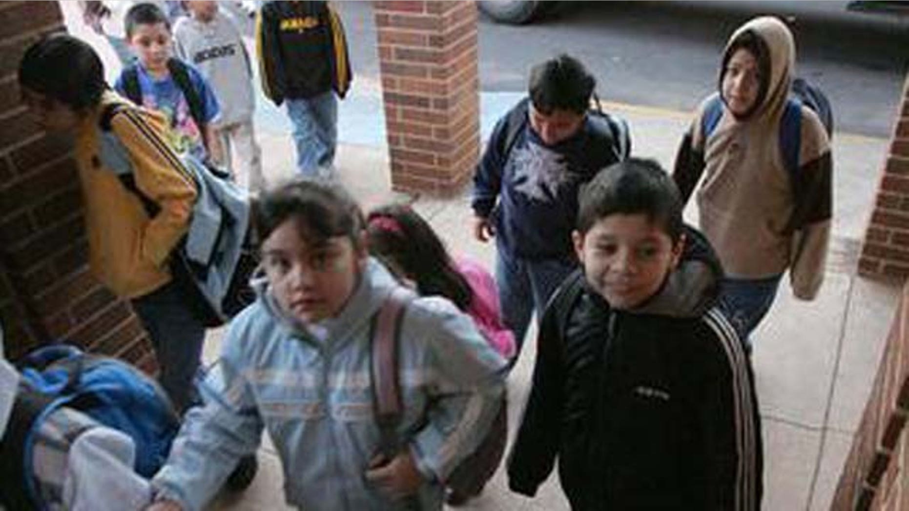 ** ADVANCE FOR WEEKEND OF MARCH 19-20 **Students make their from their buses to school at the Lyman Hall Elementary school in Gainesville, Ga., Wednesday, Feb. 23, 2005. Lyman Hall Elementary is listed as 94 percent Hispanic. (AP Photo/Ric Feld)