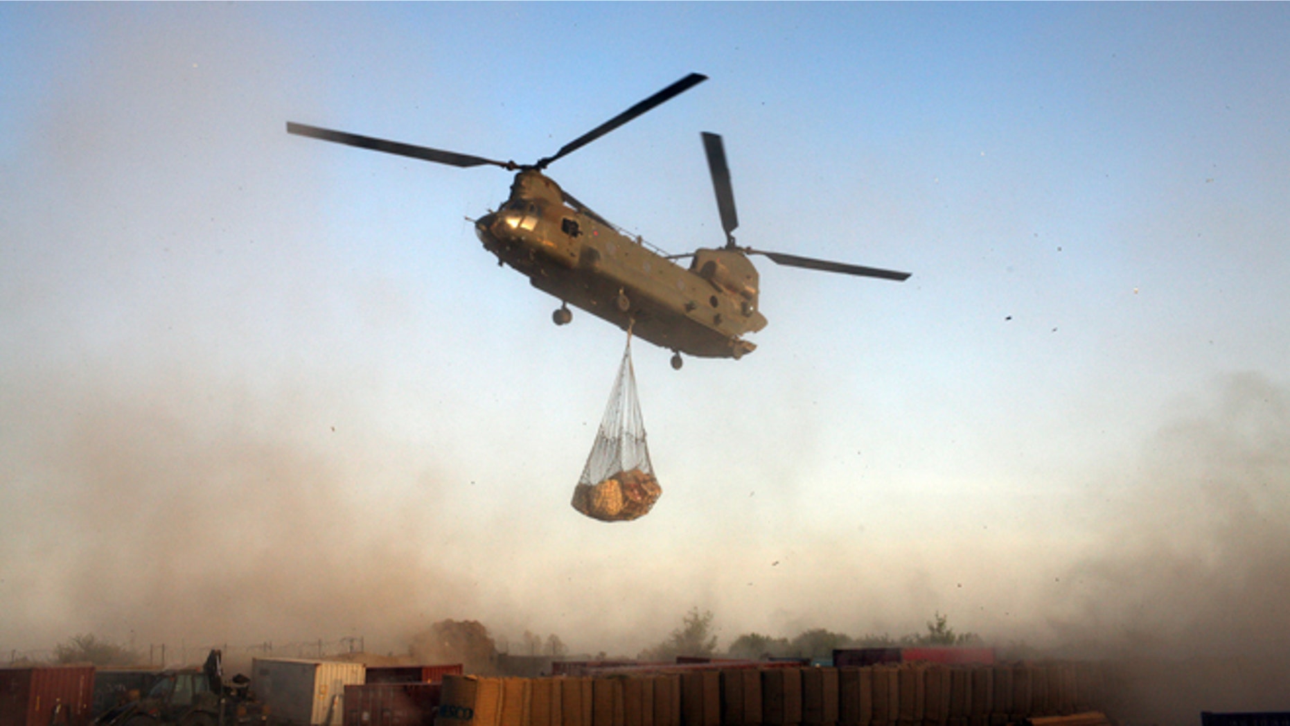 UPPER GERESHK VALLEY, AFGHANISTAN - JULY 9: A Royal Air Force Chinook helicopter delivers supplies to the British Paratroopers from the 2nd Battalion The Parachute Regiment on July 9, 2008 in Gibraltar FOB (Forward Operating Base) in Upper Gereshk Valley,Helmand Province, Afghanistan. The British Paratroopers from the 2nd Battalion The Parachute Regiment are deployed in the Upper Gereshk Valley with the aim of supporting the Afghan National Government in their fight against the Taliban and providing security for the local nationals. (Photo by Marco Di Lauro/Getty Images)