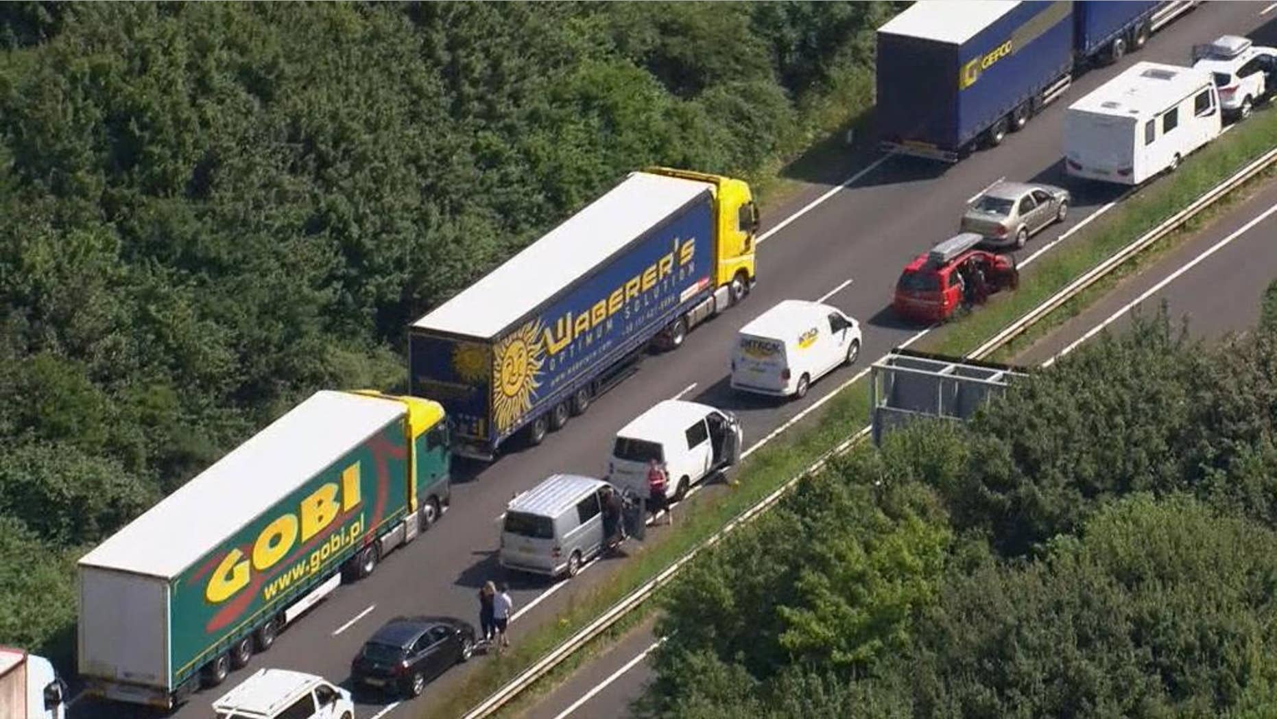 In this aerial view taken from video, part of the miles long queue of traffic outside Dover, England, waiting to cross the English Channel into France, Saturday July 23, 2016, as France is under a state of emergency. Heightened French border security checks caused massive disruption for many hours Saturday as some thousands of travelers tried to make the journey into France. (Sky via AP)