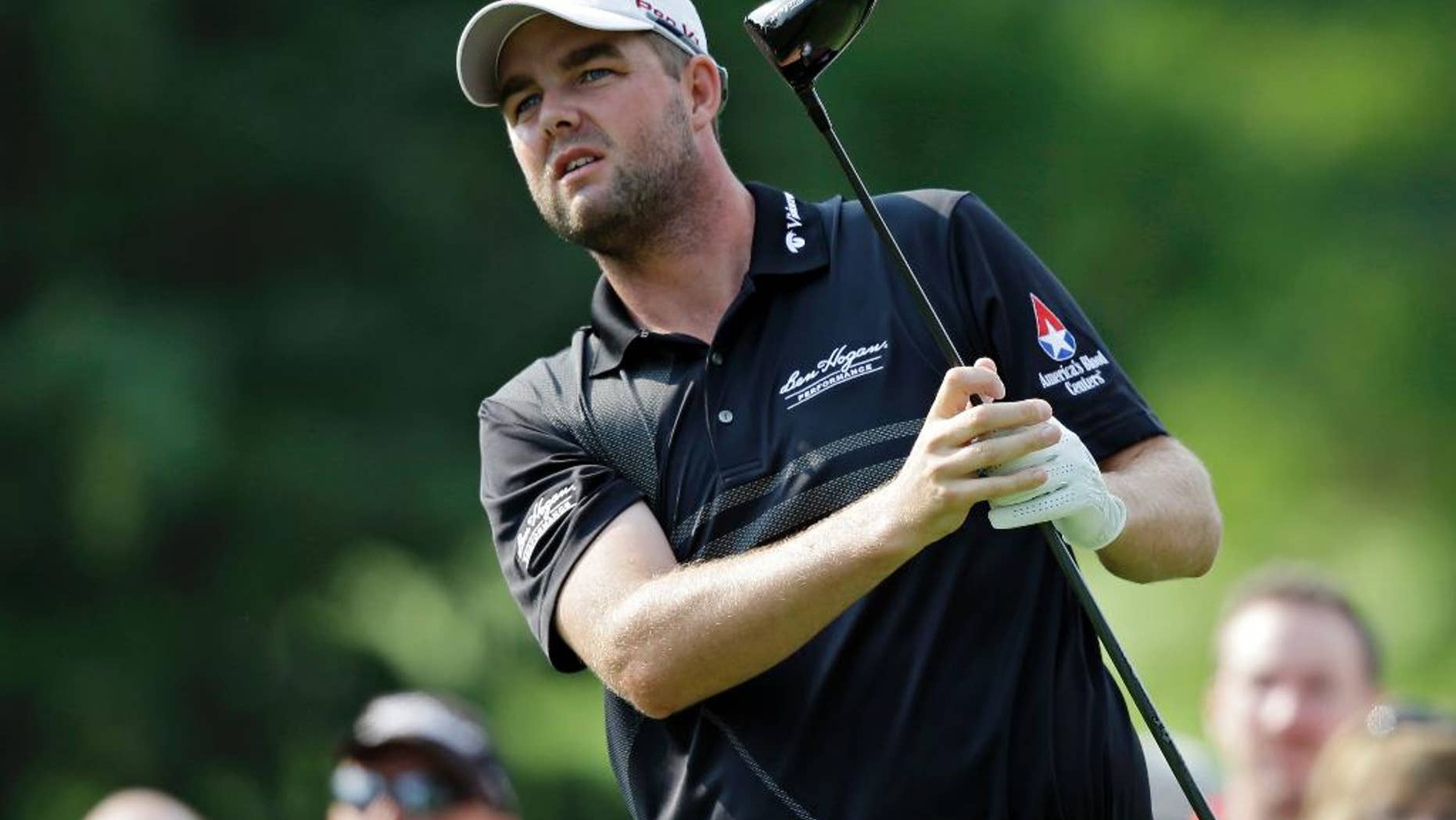 FILE - In this Aug. 2, 2014, file photo, Marc Leishman watches his drive on the third hole during the third round of the Bridgestone Invitational golf tournament at Firestone Country Club in Akron, Ohio. Lieshman, who has missed recent Tour events for family reasons, returns this week at the Zurich Classic in New Orleans. (AP Photo/Mark Duncan, File)