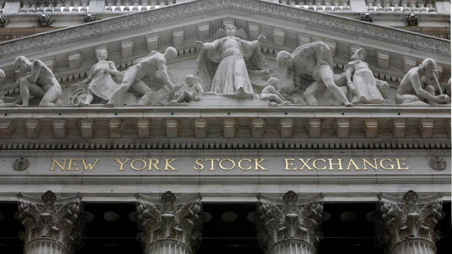 This Thursday, Oct. 2, 2014 photo shows the facade of the New York Stock Exchange. U.S. stocks rose again Friday, Oct. 24, 2014, putting the market on track for the best week in almost two years. Amazon plunged after the company reported dismal third-quarter results, but that wasn't enough to drag the rest of the market down. (AP Photo/Richard Drew)