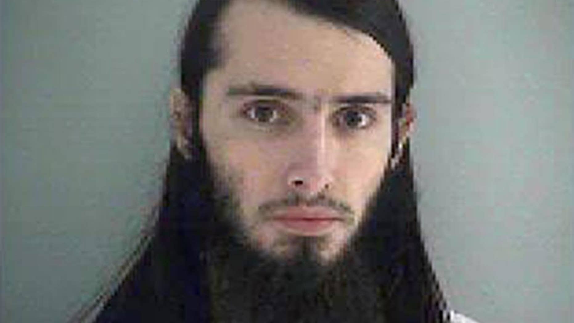 FILE-This Wednesday Jan. 14, 2015 file photo made available by the Butler County Jail shows Christopher Lee Cornell. The attorney for Cornell, an Ohio man accused of plotting to attack the U.S. Capitol building Monday asked a federal judge to allow the man a private review of video and audio files in the case against him. (AP Photo/Butler County Jail, File)
