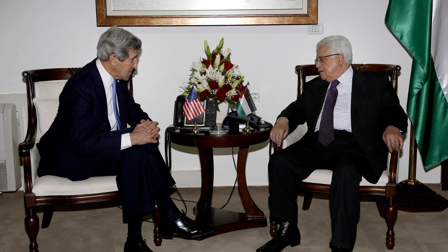 Palestinian President Mahmoud Abbas, right, meets with U.S. Secretary of State John Kerry in the West Bank city of Ramallah Sunday, April 7, 2013. (AP Photo/Mohamed Torokman, Pool)