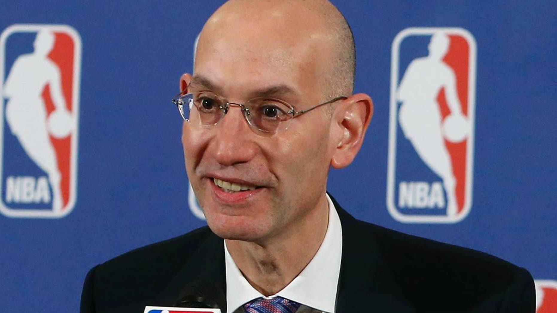 FILE - In this May 21, 2013, file photo, Adam Silver speaks during a news conference before the NBA basketball draft lottery in New York. The NBA has suspended Charlotte Hornets forward Jeffery Taylor for 24 games without pay after he pleaded guilty last month to misdemeanor domestic violence assault and malicious destruction of hotel property. "This suspension is necessary to protect the interests of the NBA and the public's confidence in it," NBA Commissioner Silver said in a release Wednesday, Nov. 19, 2014. (AP Photo/Jason DeCrow, File)