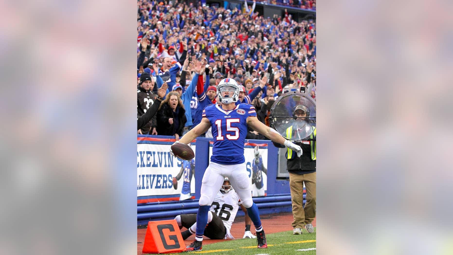 Buffalo Bills wide receiver Chris Hogan celebrates after scoring a touchdown against the Cleveland Browns during the second half of an NFL football game, Sunday, Nov. 30, 2014, in Orchard Park, N.Y. (AP Photo/Bill Wippert)