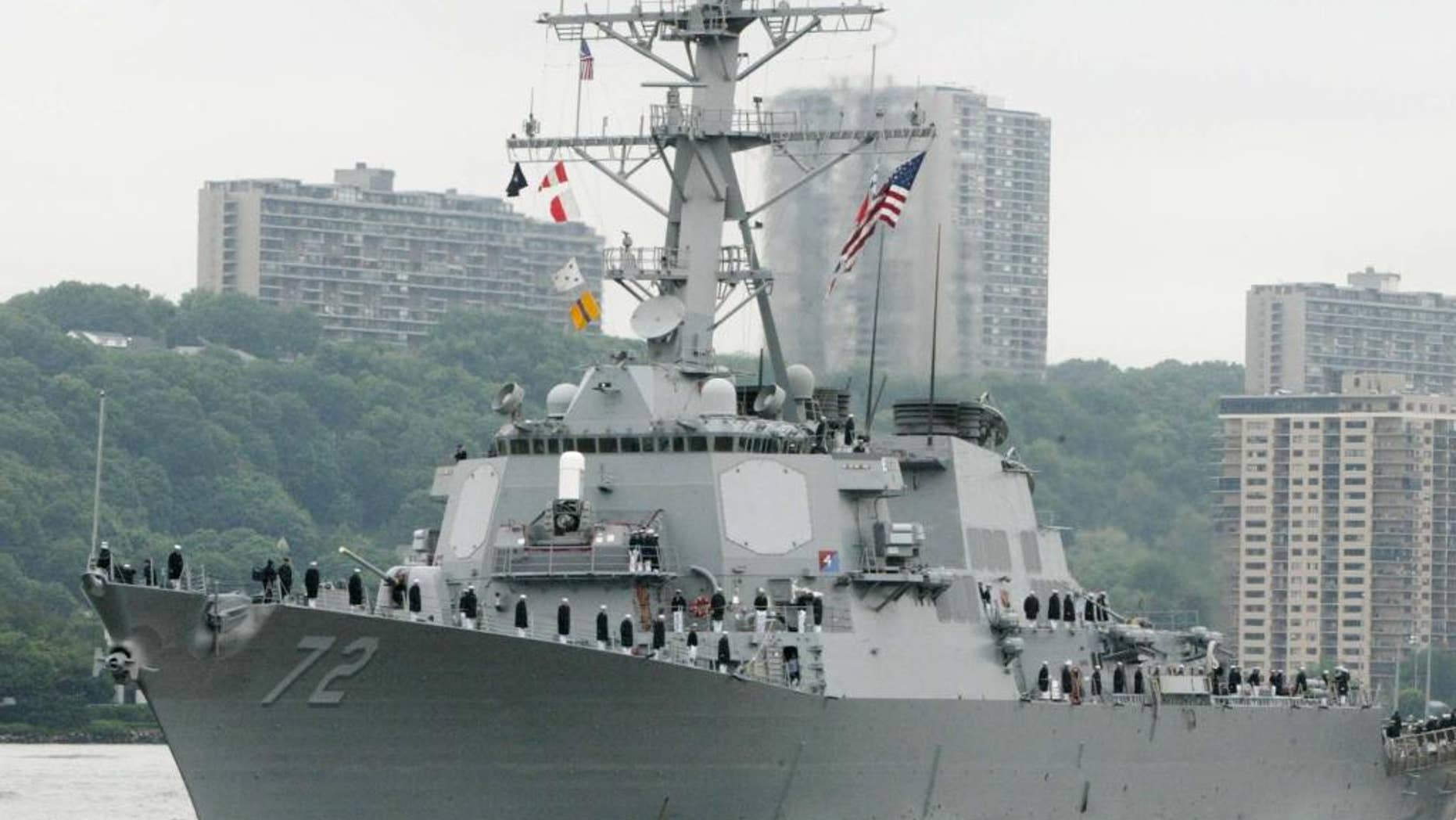 FILE - In this May 26, 2004 file photo, the USS Mahan, a guided-missile destroyer, moves up the Hudson River in New York during Fleet Week. A U.S. Navy guided-missile destroyer fired a warning flare toward an Iranian Revolutionary Guard vessel coming near it in the Persian Gulf, an American official said Wednesday, the latest tense naval encounter between the two countries. (AP Photo/Ed Bailey, File)