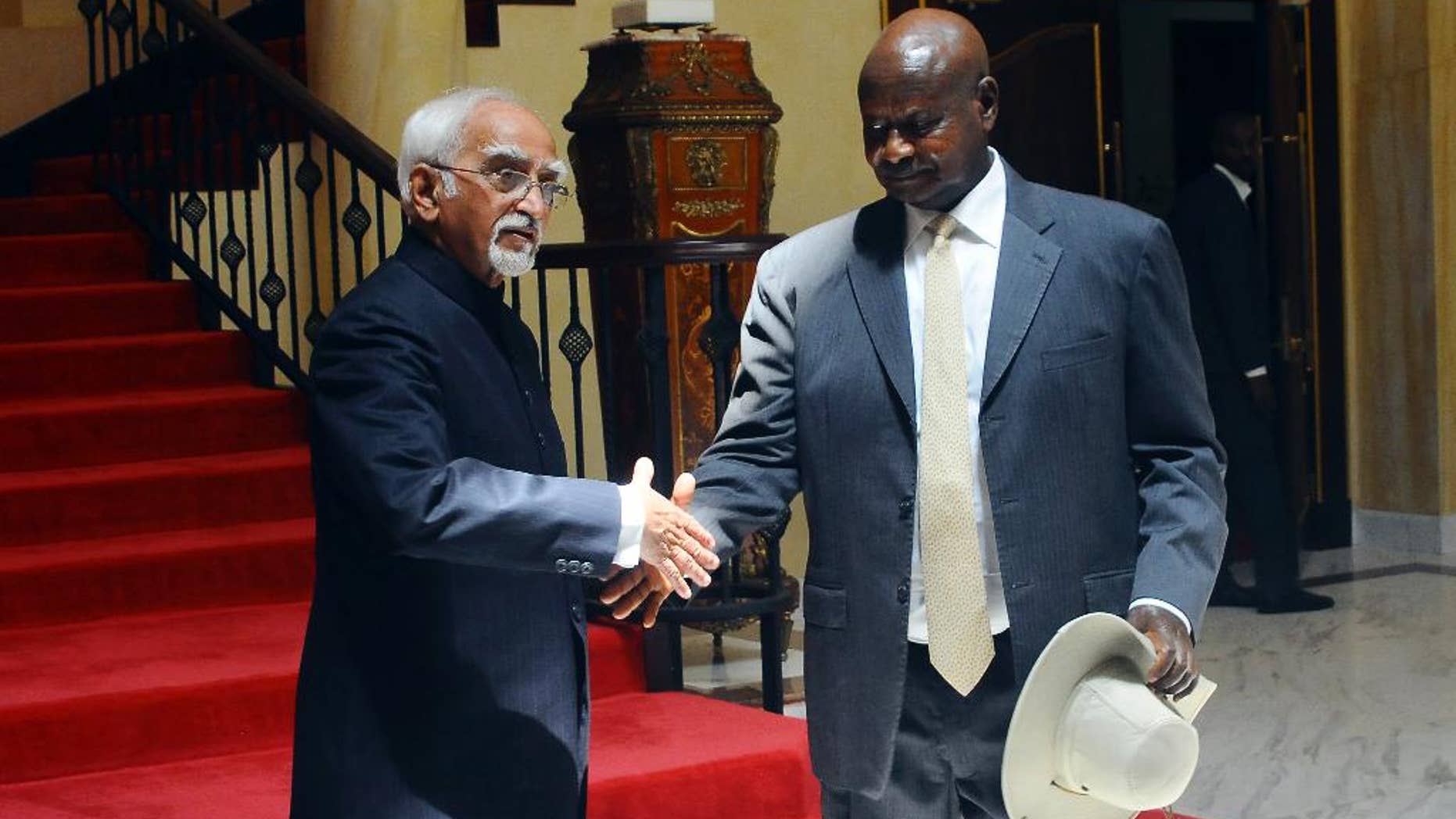 Vice President of India Shri M. Hamid Ansari, left, meets with Uganda's President Yoweri Museveni, right, at State House in Entebbe, Uganda Wednesday, Feb. 22, 2017. Ansari is on a three-day bilateral visit to the East African nation. (AP Photo/Ronald Kabuubi)