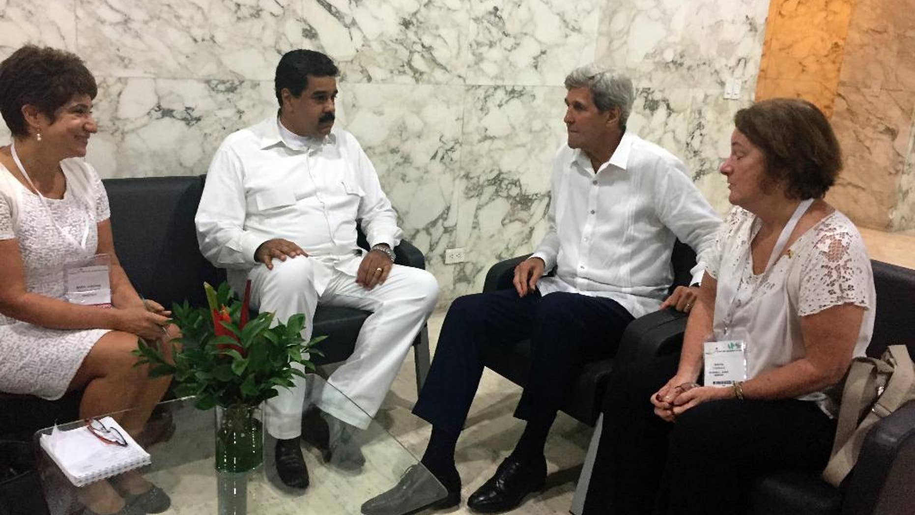 U.S. Secretary of State John Kerry meets with Venezuela president Nicolas Maduro in Cartagena, Colombia Monday, Sept. 26, 2016. (AP Photo/Vivian Salama)