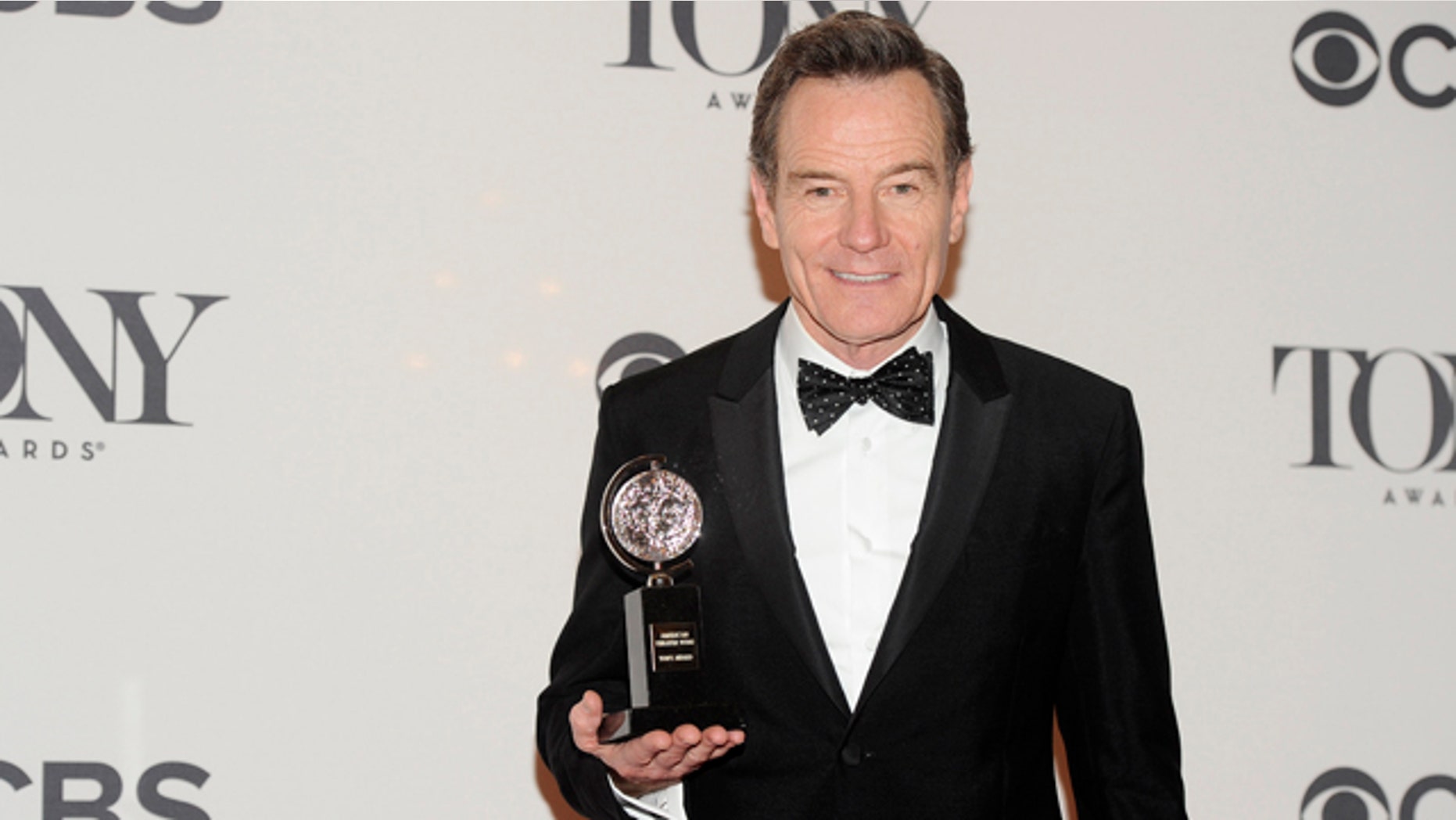 June 8, 2014: Bryan Cranston poses with his award for best actor in a play for 'All the Way' in the press room at the 68th annual Tony Awards at Radio City Music Hall in New York. (Photo by Charles Sykes/Invision/AP)