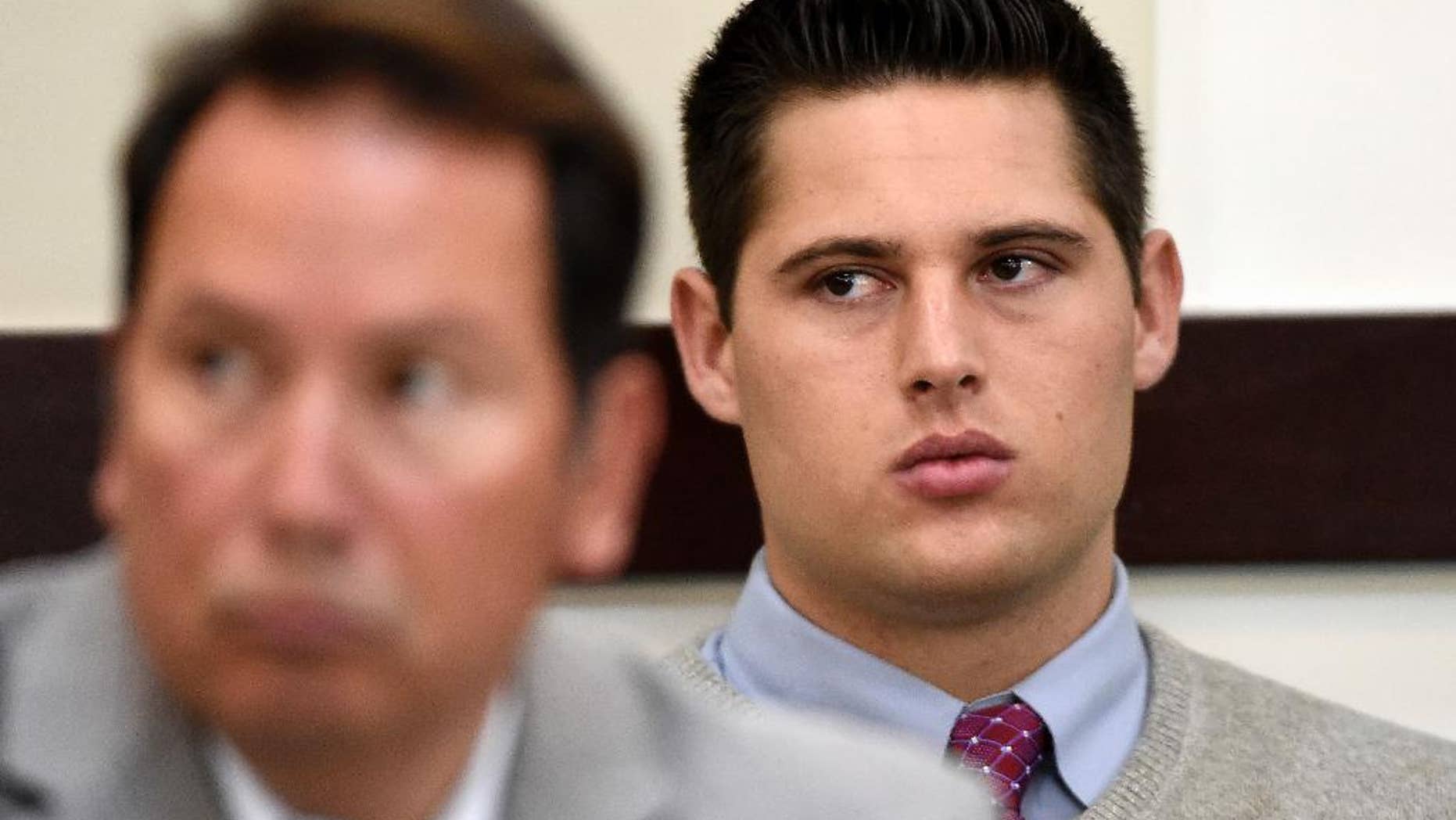 Brandon Vandenburg, right, a former Vanderbilt football player, listens during his rape trial Saturday, June 18, 2016, in Nashville, Tenn. A jury earlier convicted Vandenburg after a trial that featured graphic cellphone videos and photos of the attack taken by the former players. However, the verdict was thrown out after it was discovered that the jury foreman had been a victim of statutory rape. (Larry McCormack, The Tennessean via AP)