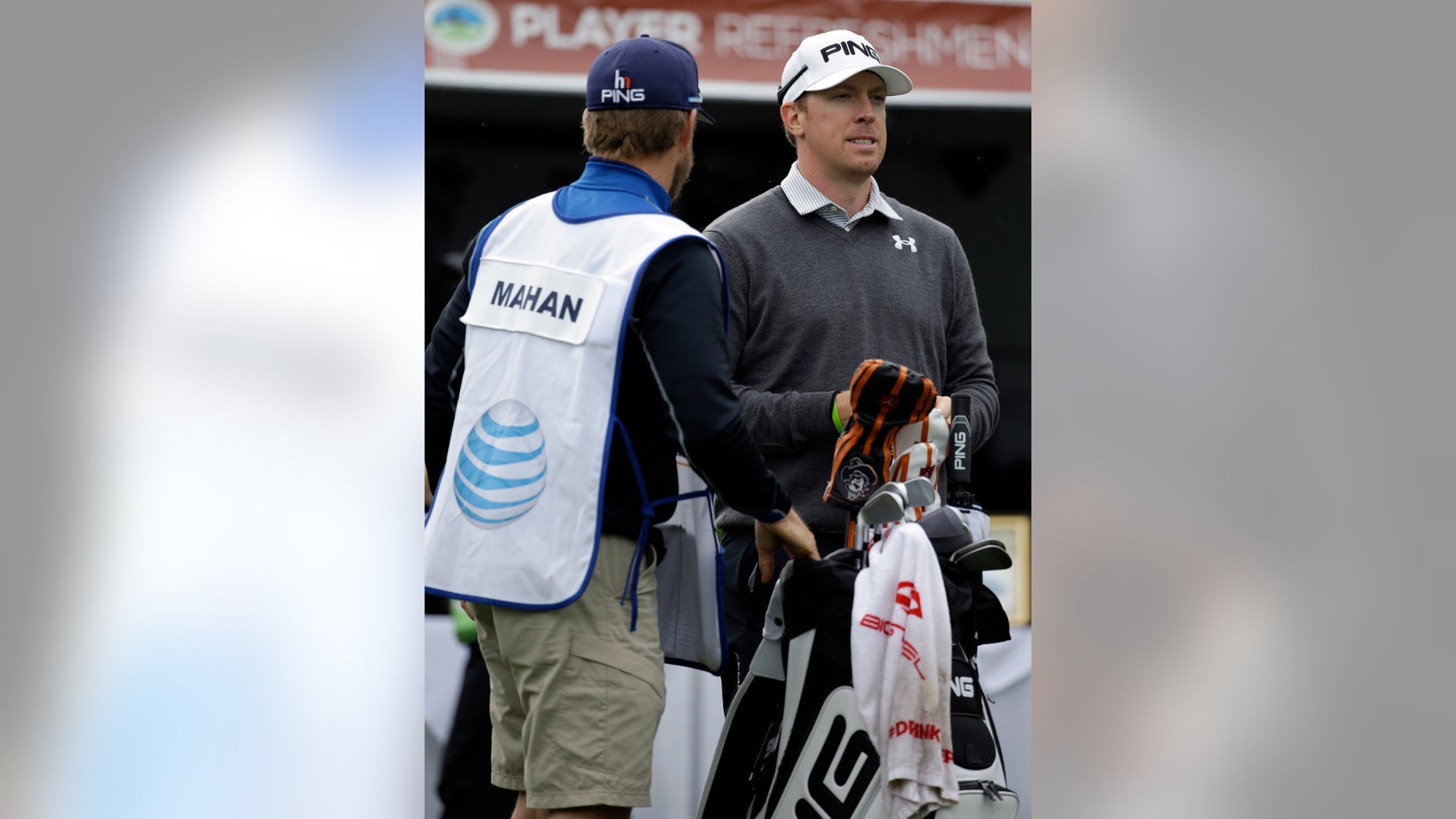 Hunter Mahan, right, waits to hit off the first tee on Friday, Feb. 7, 2014, during the second round of the AT&T Pebble Beach Pro-Am golf tournament on the Spyglass Hill Golf Course in Pebble Beach, Calif. (AP Photo/Ben Margot)