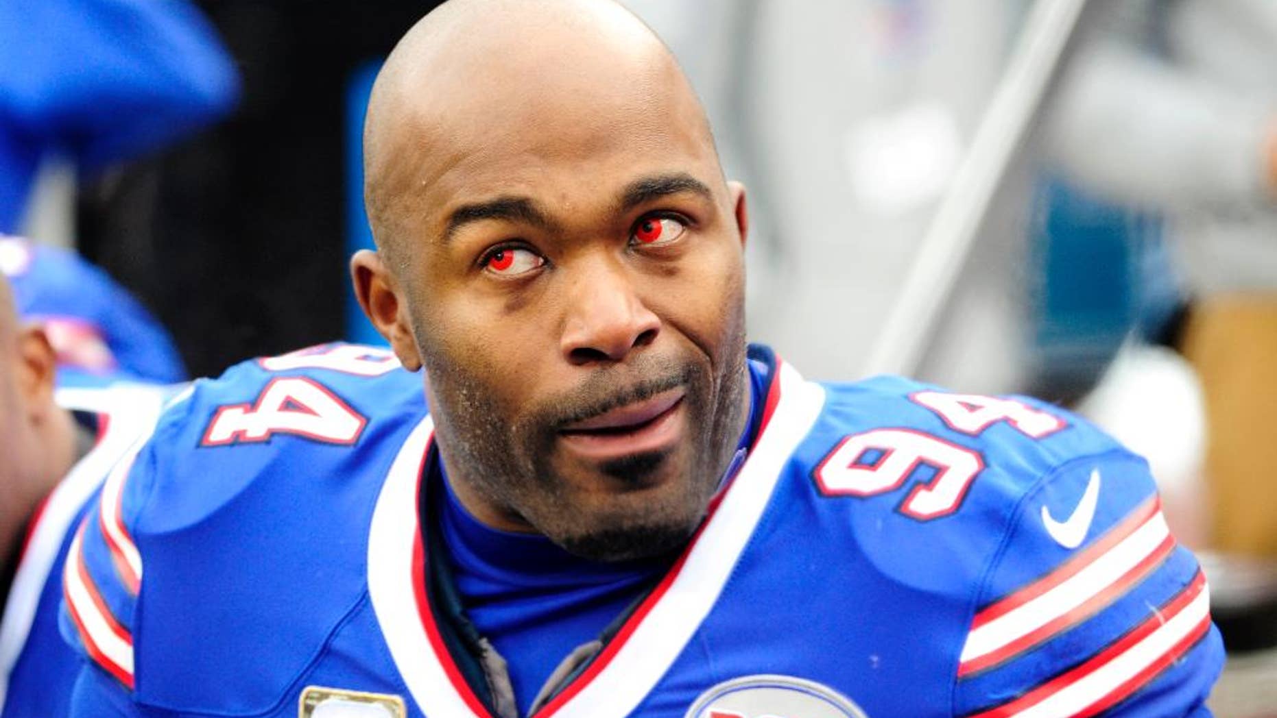 Kansas City Chiefs strong safety Ron Parker, left, forces a fumble off Buffalo Bills running back Bryce Brown during the second half of an NFL football game, Sunday, Nov. 9, 2014, in Orchard Park, N.Y. (AP Photo/Bill Wippert)