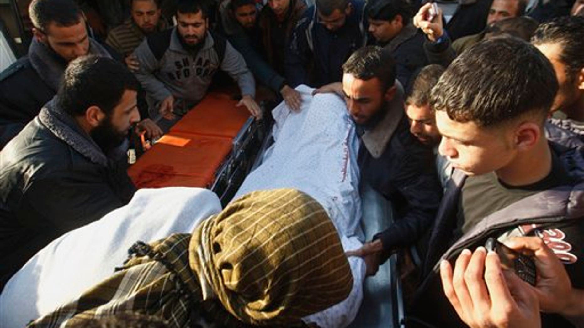 March 9: Palestinian carry the body of Zuhair al-Qaissi, a commander of the armed wing of the Popular Resistance Committees (PRC) in Gaza City.