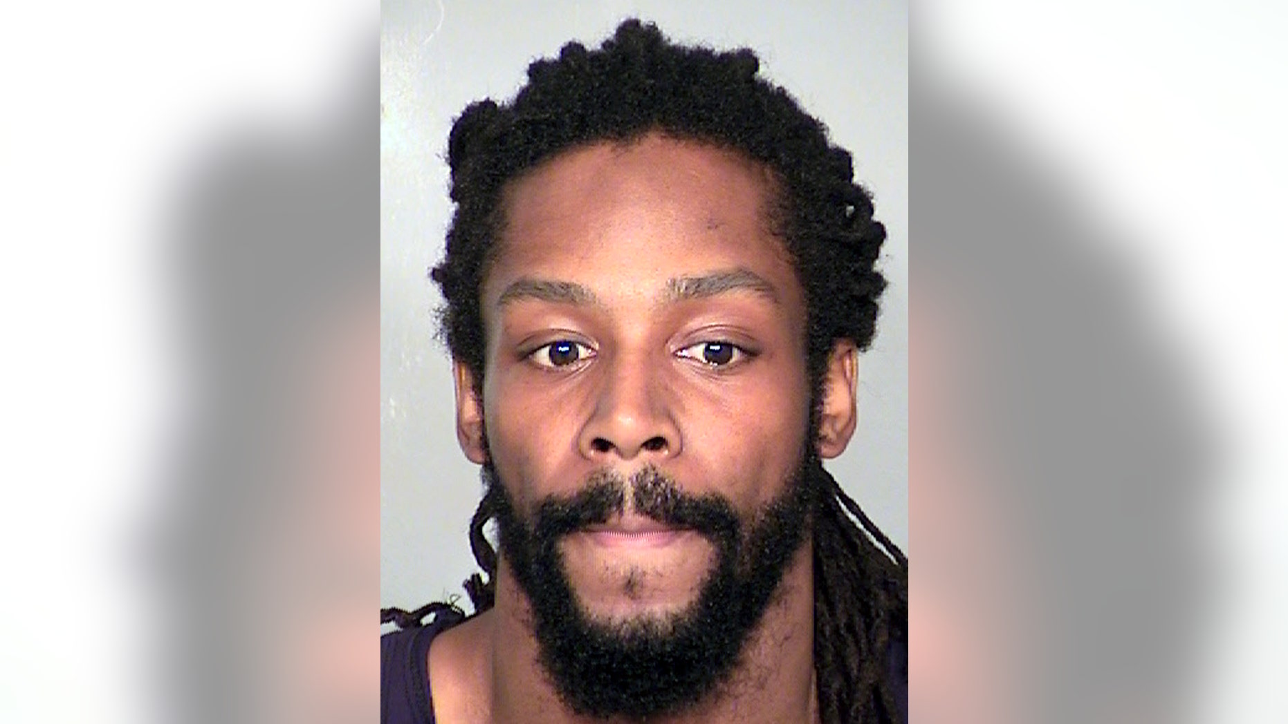 This image provided by the Clark County Detention Center shows Kirk Bills, who has been accused of trying to burn a pet shop where 27 puppies were rescued last month. Bills has been returned in custody to Las Vegas to face arson and other charges, authorities said Thursday, Feb. 20, 2014. (AP Photo/Clark County Detention Center)
