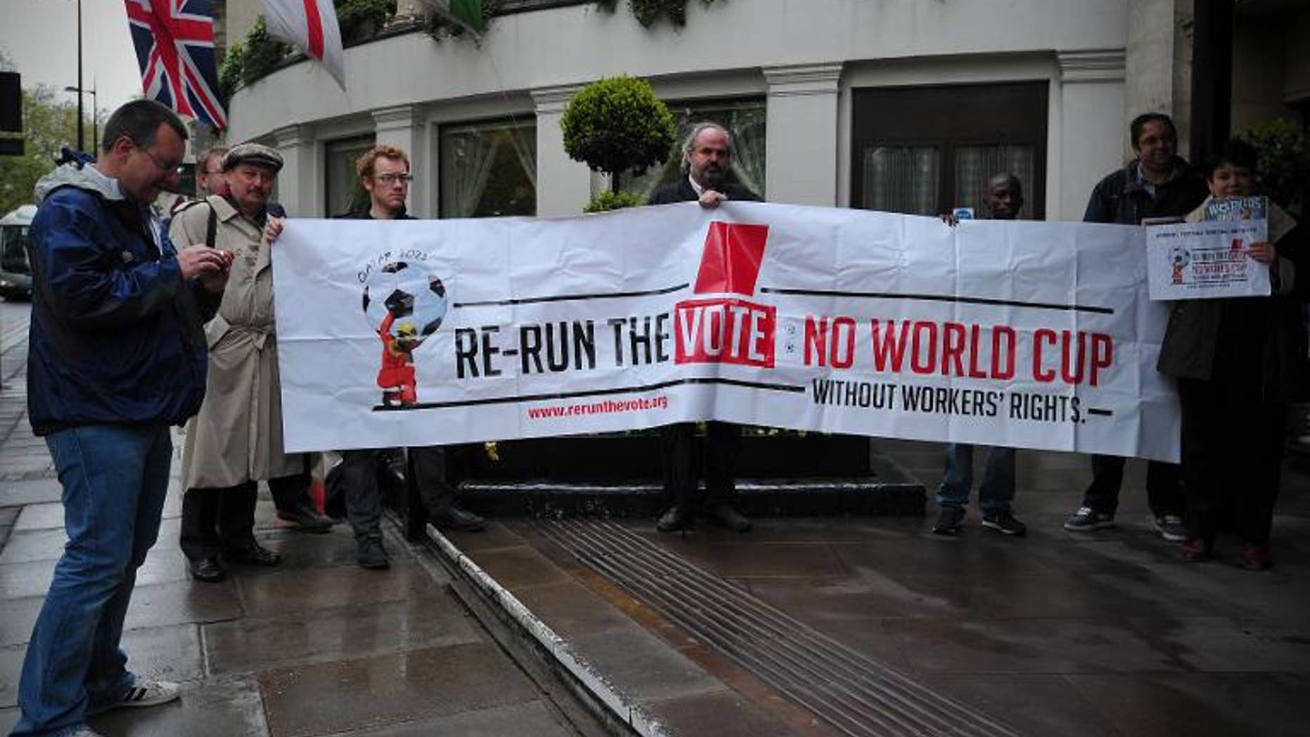 Protesters demonstrate against the perceived exploitation of workers in Qatar, the location of the 2022 World Cup, before a UEFA Congress in central London on May 24, 2013