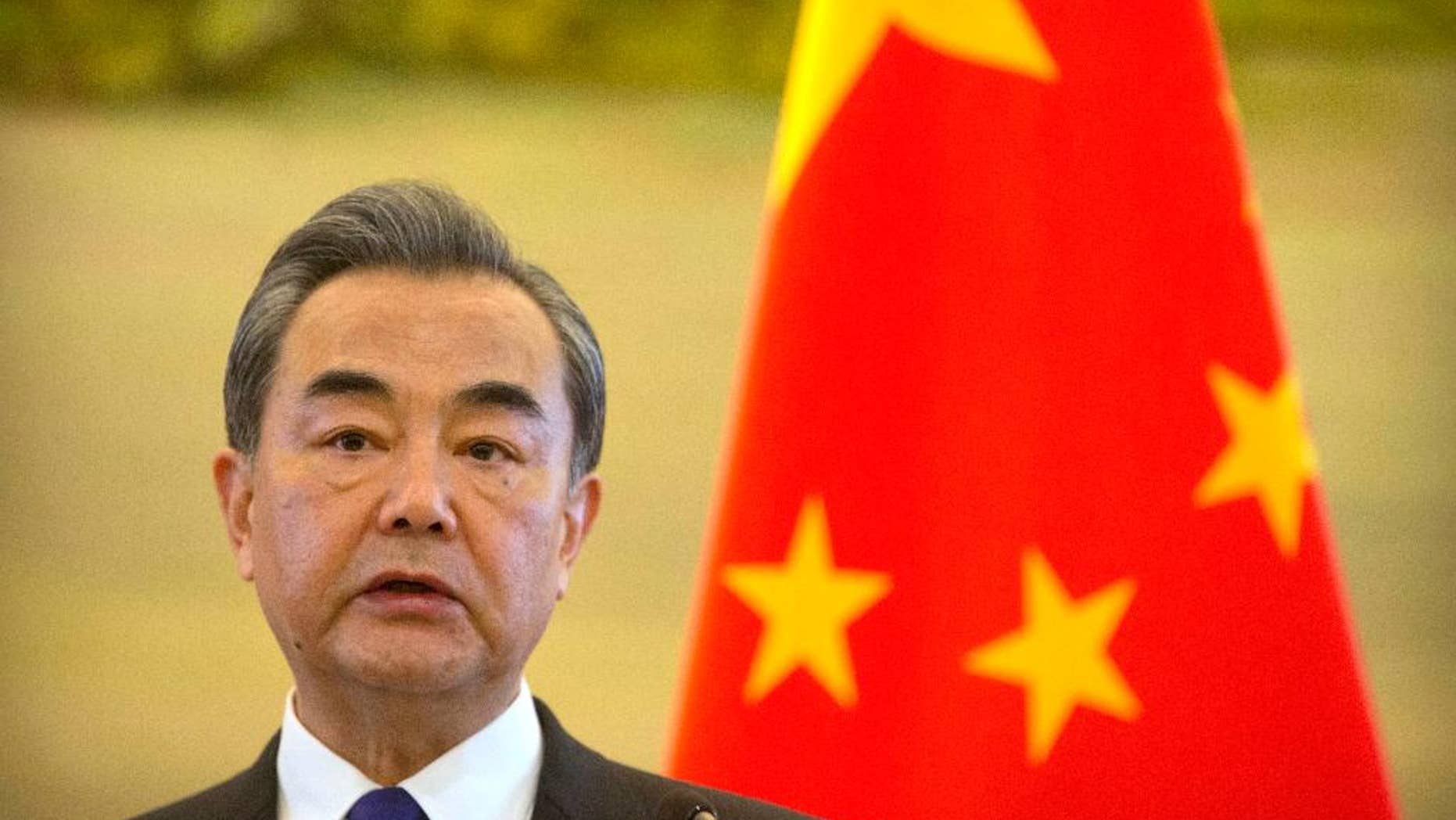 FILE - In this Thursday, April 13, 2017 file photo, Chinese Foreign Minister Wang Yi speaks during a joint press conference with the Palestinian Foreign Minister at the Ministry of Foreign Affairs in Beijing. Wang made a new appeal for calm on the Korean peninsula Tuesday, April 18, 2017, and said he believes the United States would prefer a diplomatic rather than military resolution to the standoff. (AP Photo/Mark Schiefelbein, File)