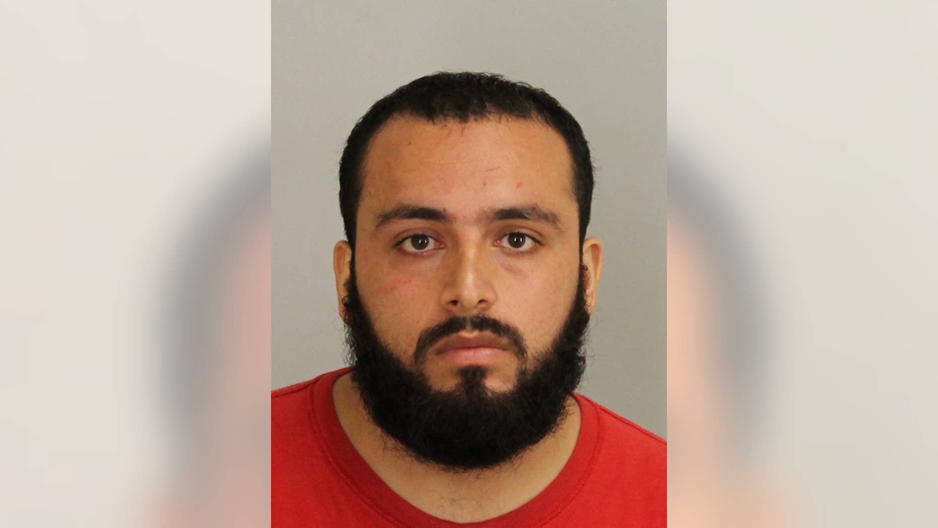 FILE - This September 2016 file photo provided by Union County Prosecutor's Office shows Ahmad Khan Rahami, who is in custody as a suspect in the weekend bombings in New York and New Jersey. Rahami worked as an unarmed night guard for two months in 2011 at an AP administrative technology office in Cranbury, N.J. At the time, he was employed by Summit Security, a private contractor. Rahami remained hospitalized Tuesday, Sept. 20, 2016, after a shootout the day before with police in New Jersey. (Union County Prosecutor's Office via AP, File)